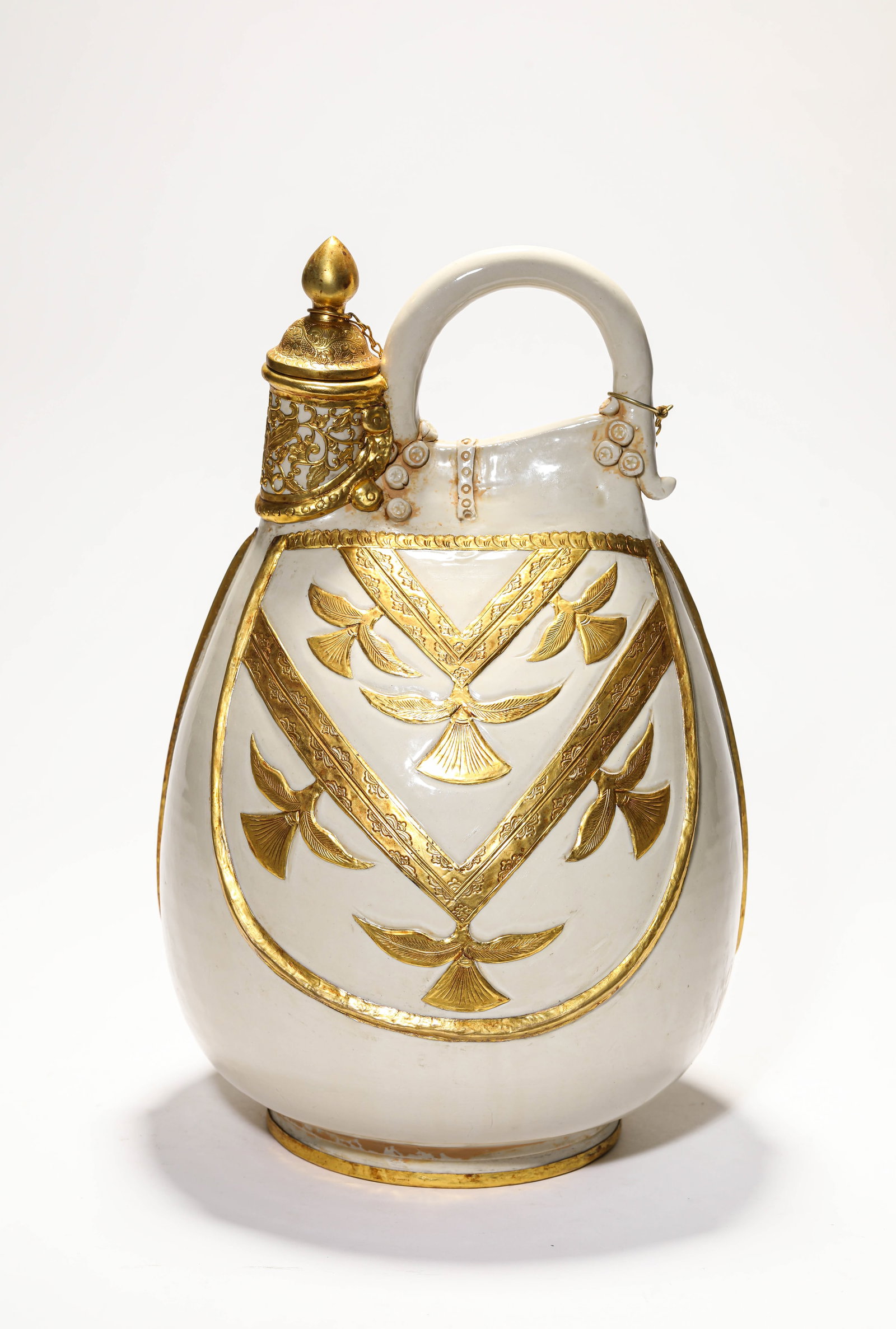 A WHITE PORCELAIN AND GILT 'LEATHER FLASK-FORM' EWER: A WHITE PORCELAIN AND GILT 'LEATHER FLASK-FORM' EWER Description: Dimensions: Length: 21.5 cm x Width: 20.5 cm x Height: 35.5 cm. All measurements are approximate.