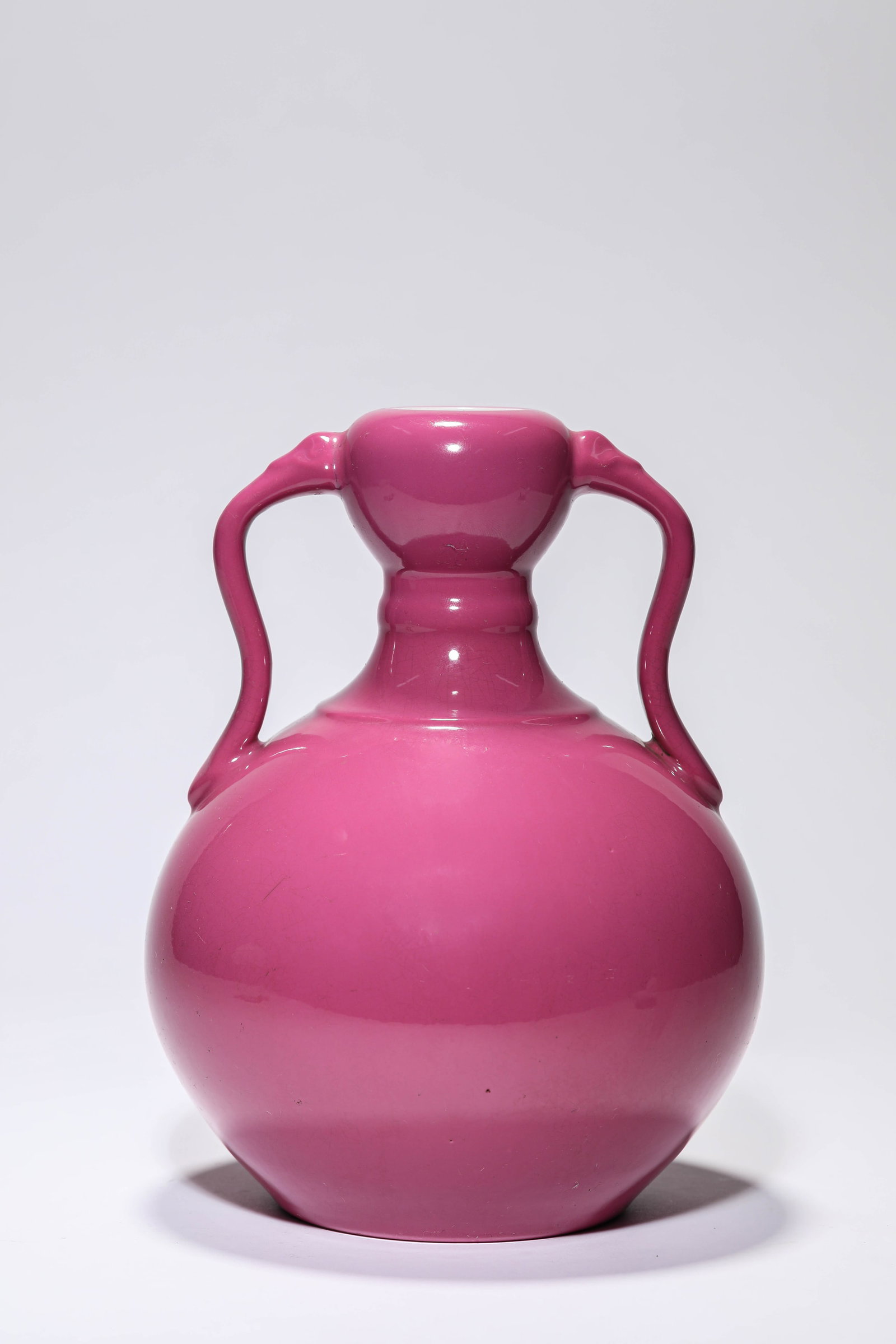 A ROUGE-GLAZED 'DOUBLE RUYI HANDLES' ZUN: A ROUGE-GLAZED 'DOUBLE RUYI HANDLES' ZUN Description: Dimensions: Width: 16.1 cm x Height: 21.4 cm. All measurements are approximate.