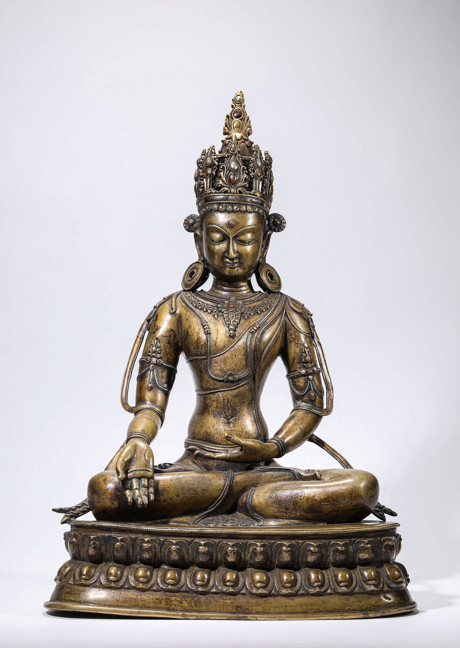 A 'LADAKH-STYLE' ALLOY BRONZE AND SILVER-INLAID FIGURE OF RATNASAMBHAVA: A 'LADAKH-STYLE' ALLOY BRONZE AND SILVER-INLAID FIGURE OF RATNASAMBHAVA Description: Dimensions: Weight: 13100 g. Length: 36.5 cm x Width: 23.3 cm x Height: 54 cm. All measurements are approximate.