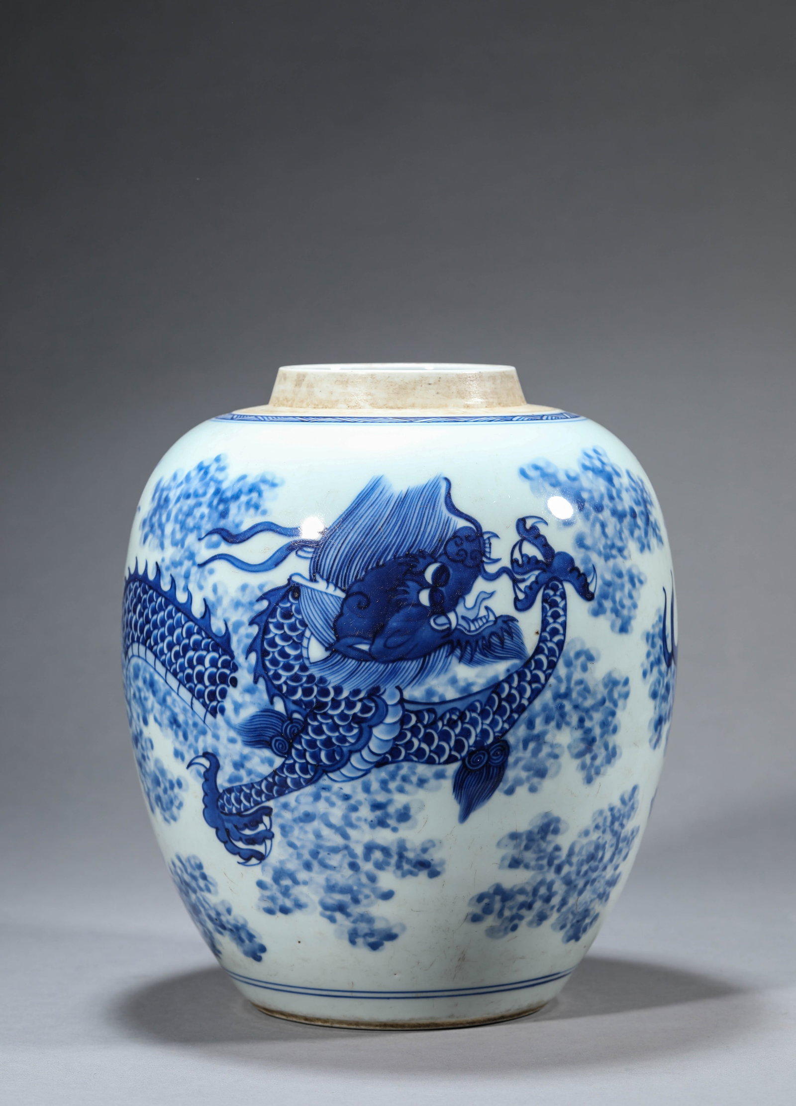 A BLUE AND WHITE 'DRAGON AMIDST CLOUDS' JAR: A BLUE AND WHITE 'DRAGON AMIDST CLOUDS' JAR Description: Dimensions: Width: 21.7 cm x Height: 26.5 cm. All measurements are approximate.