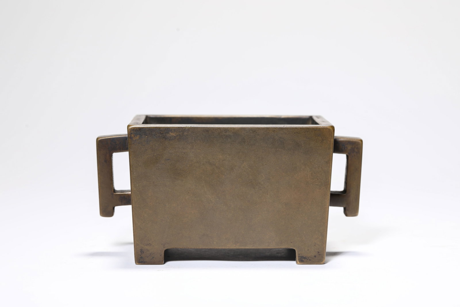 A BRONZE 'TROUGH-FORM' CENSER: A BRONZE 'TROUGH-FORM' CENSER Description: Dimensions: Weight: 1331 g. Length: 14.8 cm x Width: 8.8 cm x Height: 7.5 cm. All measurements are approximate.