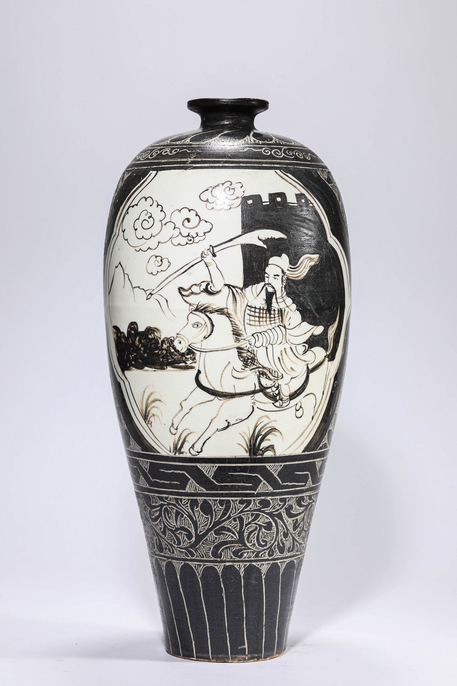 A CIZHOU-TYPE 'BLACK-GLAZED CARVED HUNTING SCENE' MEIPING: A CIZHOU-TYPE 'BLACK-GLAZED CARVED HUNTING SCENE' MEIPING Description: Dimensions: Width: 20.2 cm x Height: 44.9 cm. All measurements are approximate.