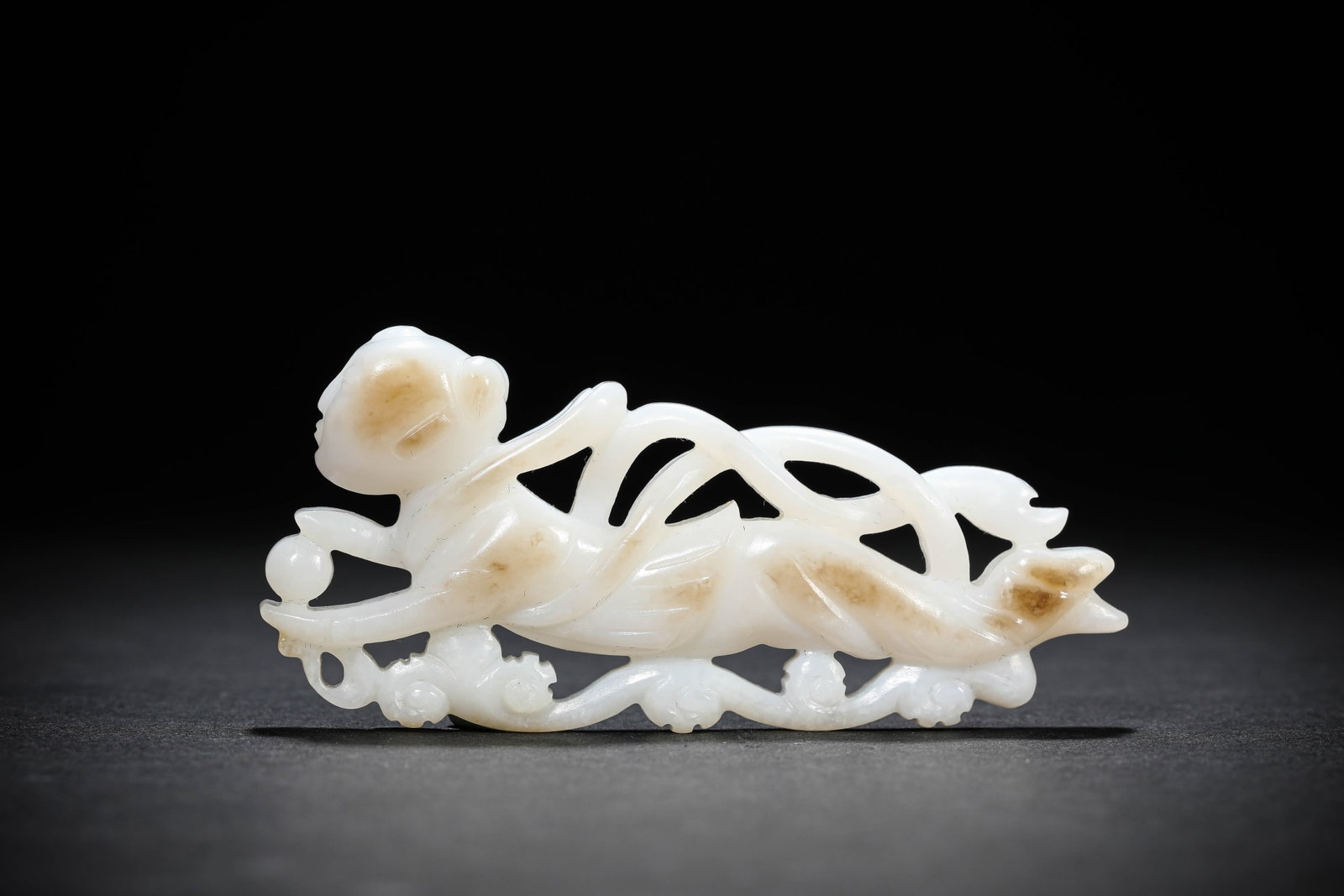 A JADE 'FLYING APSARA': A JADE 'FLYING APSARA' Description: Dimensions: Length: 9 cm x Width: 1.3 cm x Height: 4.1 cm. All measurements are approximate.