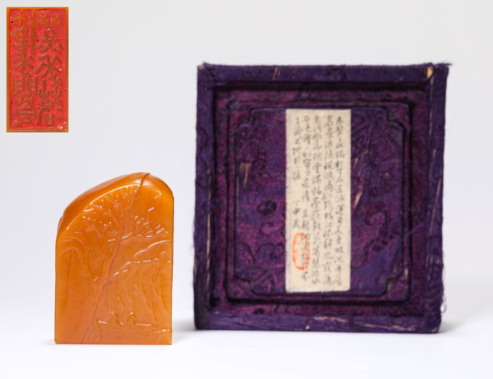 A TIANHUANG STONE 'CARVED NARRATIVE SCENE' SEAL: A TIANHUANG STONE 'CARVED NARRATIVE SCENE' SEAL Description: Dimensions: Length: 3.9 cm x Width: 2.2 cm. All measurements are approximate. (????????)