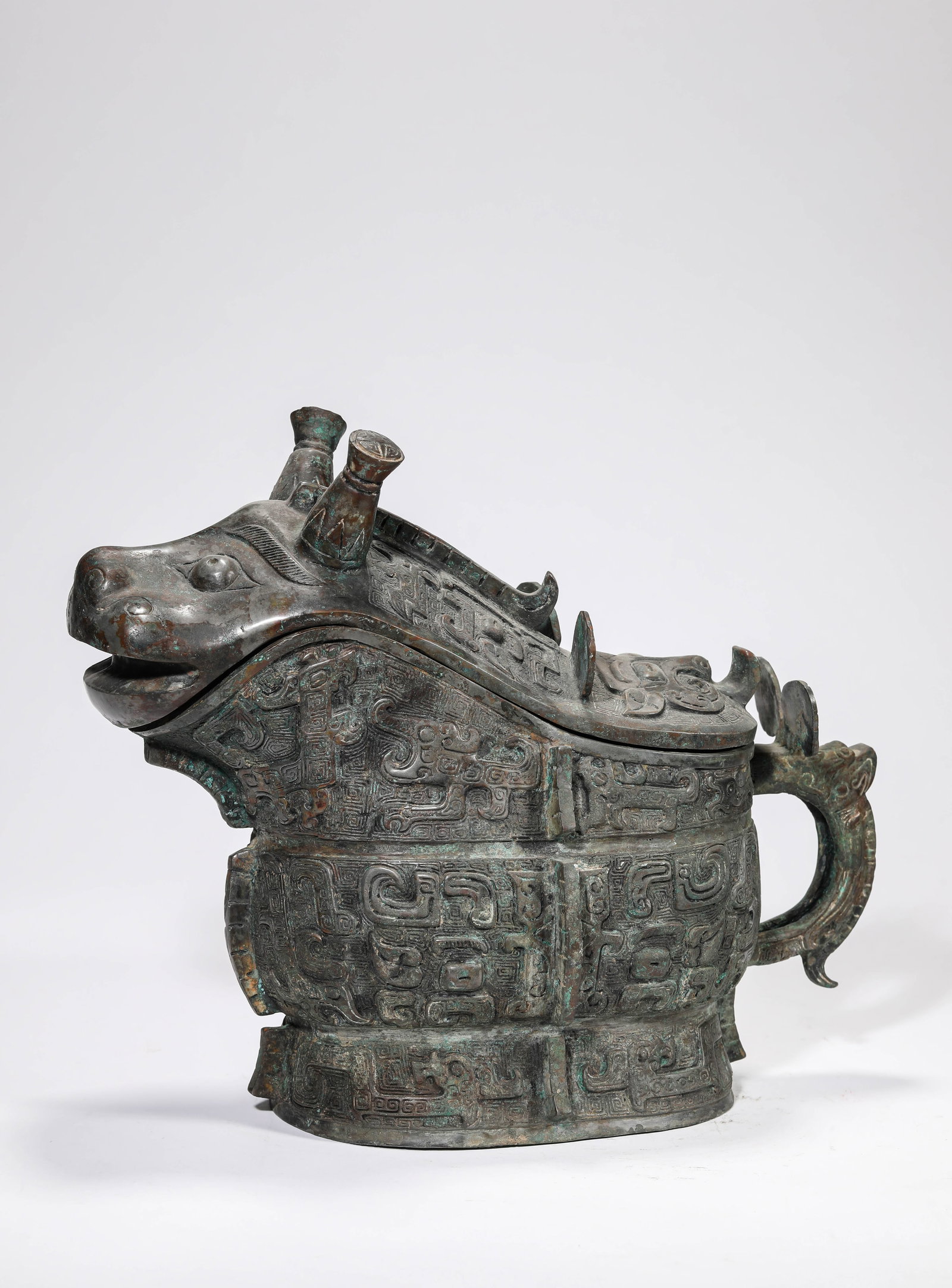 A BRONZE 'GONG' RITUAL WINE VESSEL (1 of 7)