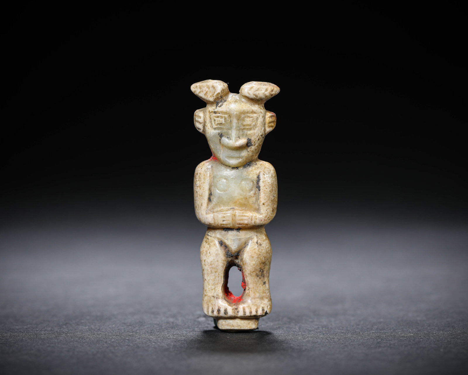 A JADE FIGURE: A JADE FIGURE Description: Dimensions: Length: 2.1 cm x Width: 1.3 cm x Height: 5.9 cm. All measurements are approximate.