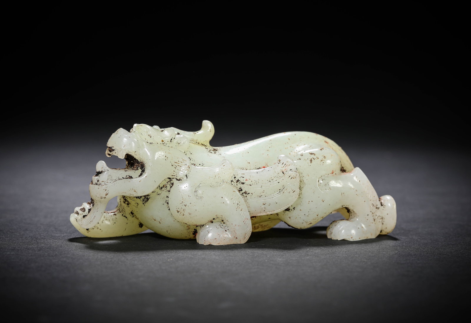 A JADE PIXIU: A JADE PIXIU Description: Dimensions: Length: 11 cm x Width: 3.6 cm x Height: 4 cm. All measurements are approximate.