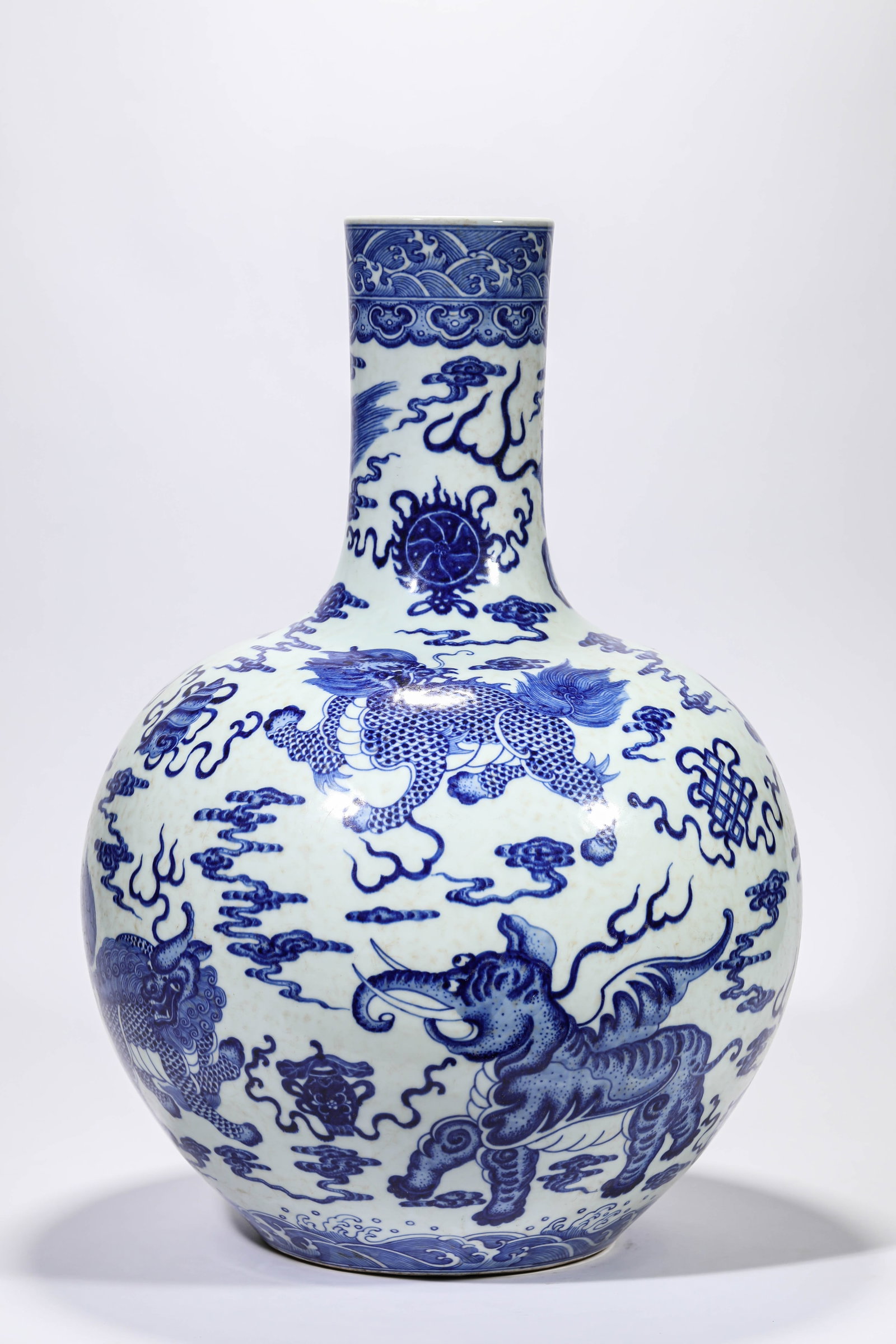 A BLUE AND WHITE 'AUSPICIOUS BEASTS AND EIGHT BUDDHIST EMBLEMS' CELESTIAL GLOBE VASE: A BLUE AND WHITE 'AUSPICIOUS BEASTS AND EIGHT BUDDHIST EMBLEMS' CELESTIAL GLOBE VASE Description: Dimensions: Width: 37.2 cm x Height: 52.9 cm. All measurements are approximate.