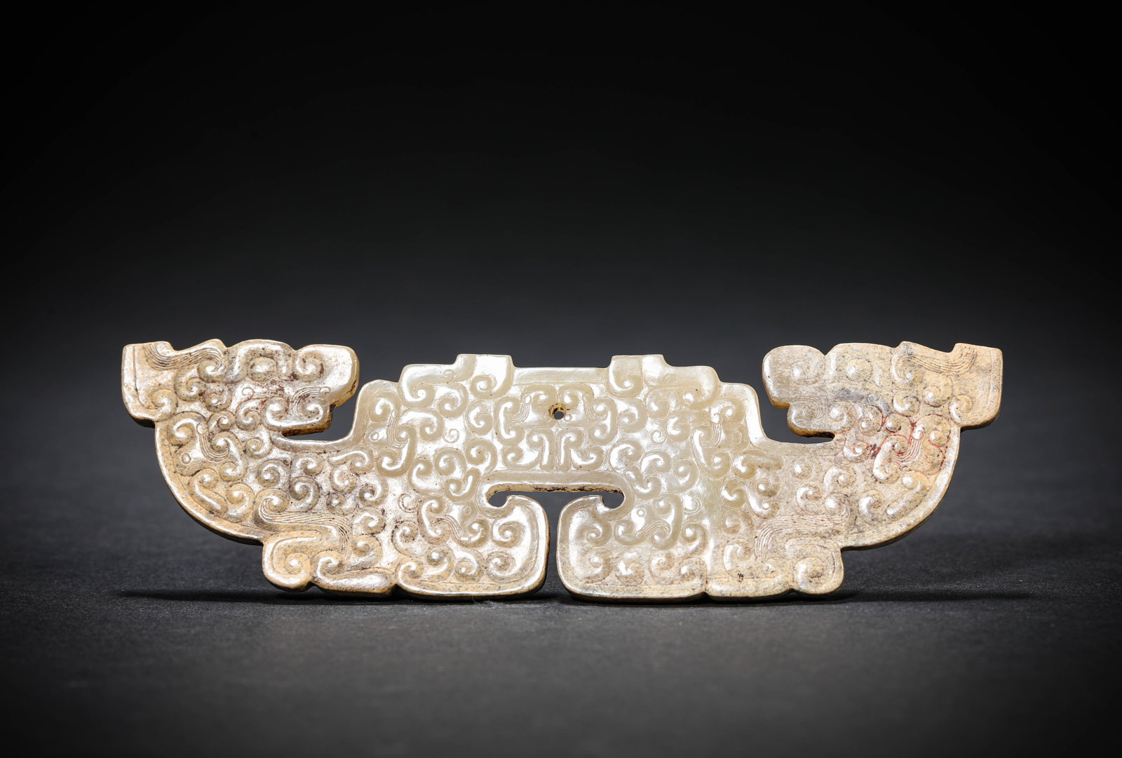 A JADE 'HUANG' PENDANT: A JADE 'HUANG' PENDANT Description: Dimensions: Width: 13.5 cm x Height: 3.9 cm. All measurements are approximate.