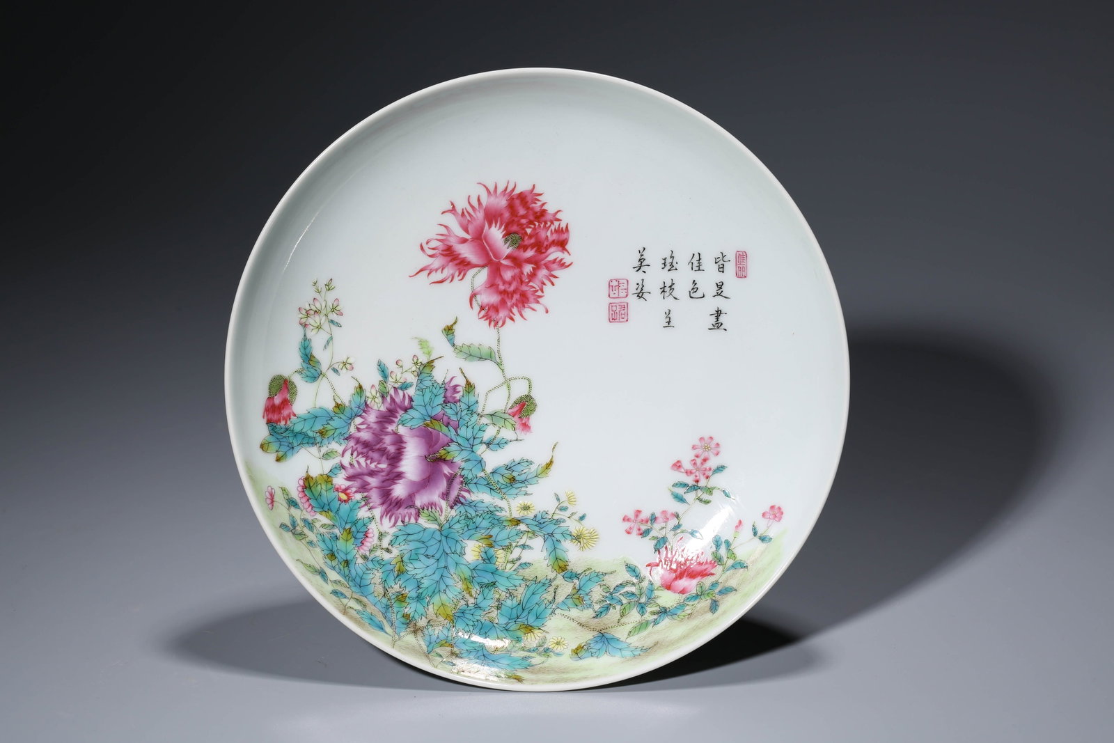 A FAMILLE-ROSE 'ORCHID AND POEM' DISH: A FAMILLE-ROSE 'ORCHID AND POEM' DISH Description: Dimensions: Width: 21 cm x Height: 4.2 cm. All measurements are approximate.