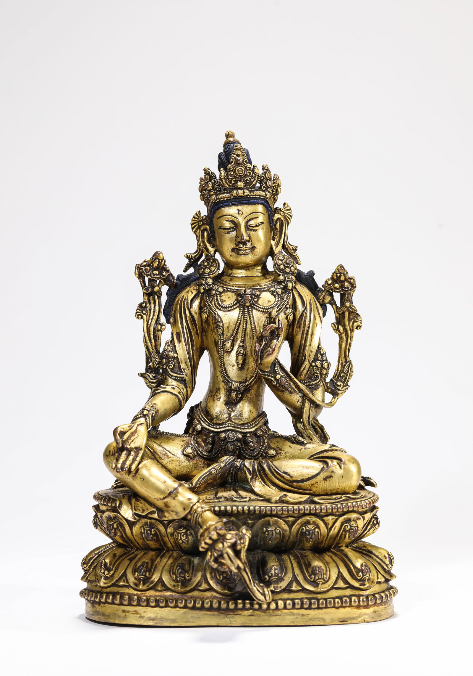 A BRONZE FIGURE OF TARA: A BRONZE FIGURE OF TARA Description: Dimensions: Weight: 2520 g. Length: 15.1 cm x Width: 13.7 cm x Height: 23.5 cm. All measurements are approximate.