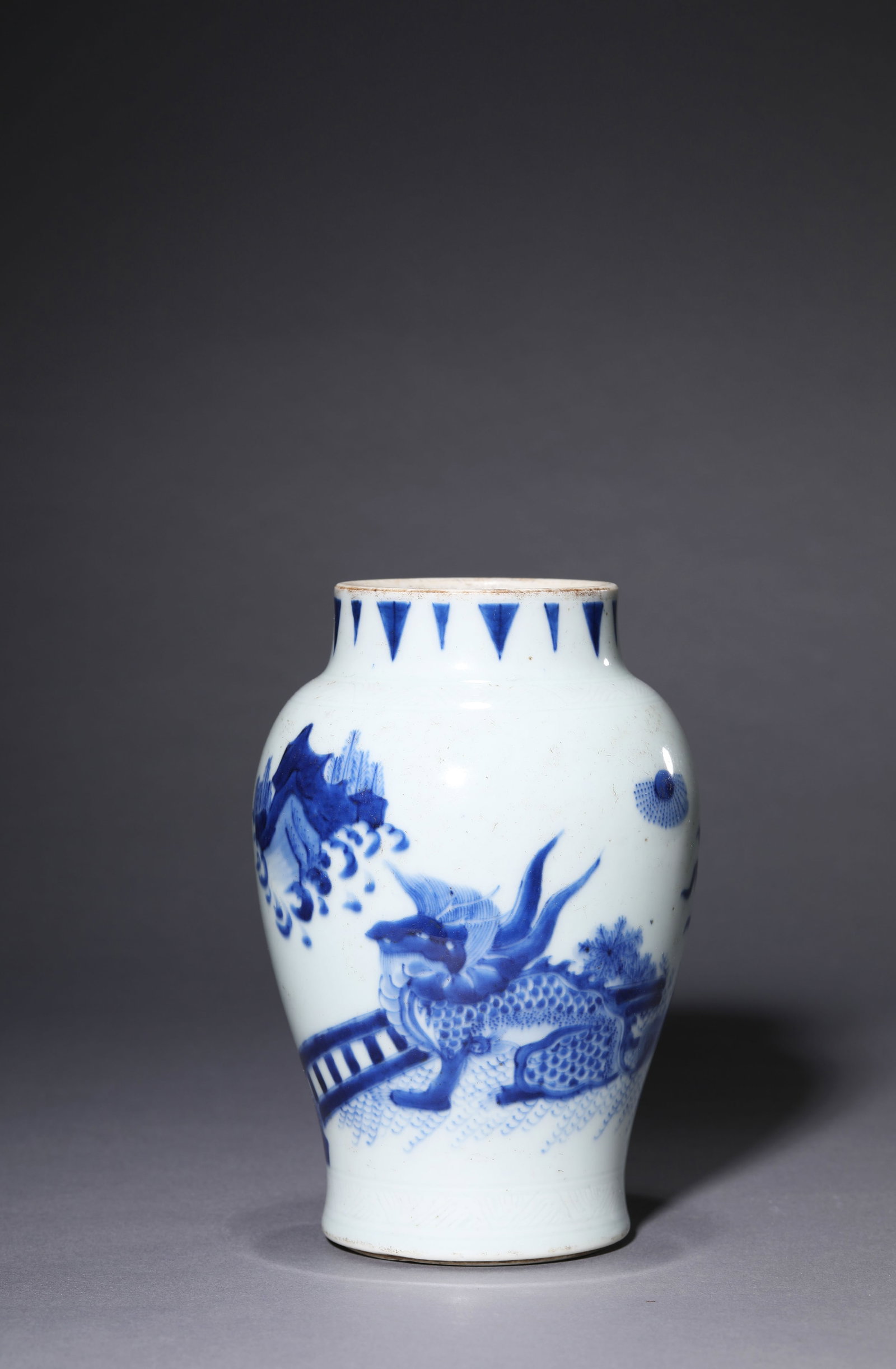 A BLUE AND WHITE 'PLANTAIN LEAF AND KYLIN' JAR: A BLUE AND WHITE 'PLANTAIN LEAF AND KYLIN' JAR Description: Dimensions: Width: 11.3 cm x Height: 16.7 cm. All measurements are approximate.