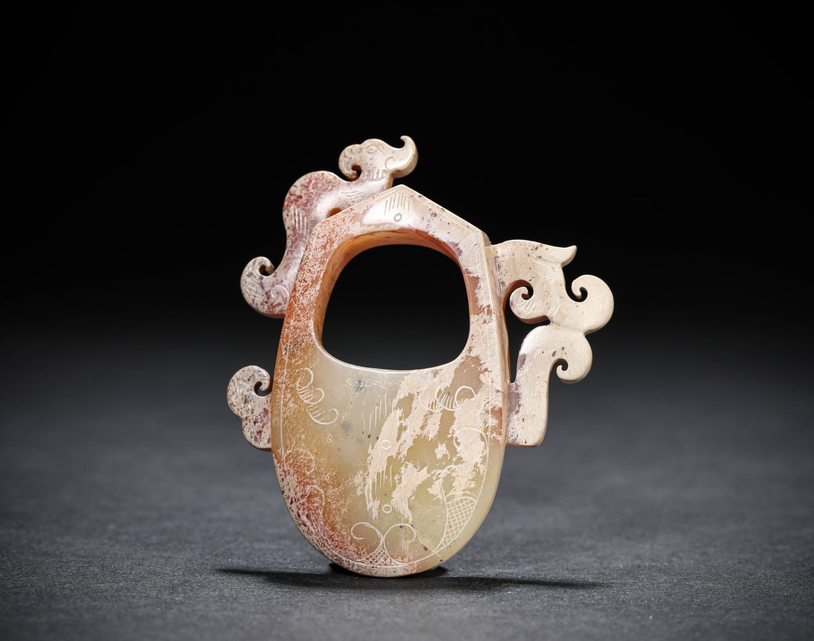 A JADE 'HEART-SHAPED' PENDANT: A JADE 'HEART-SHAPED' PENDANT Description: Dimensions: Length: 5.5 cm x Width: 1.2 cm x Height: 6.6 cm. All measurements are approximate.