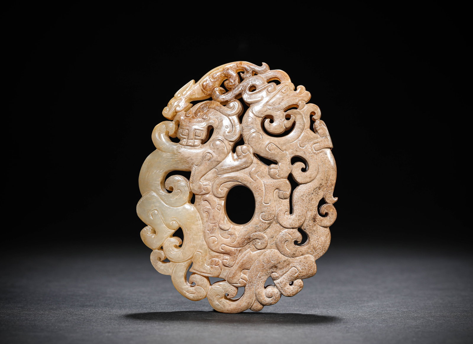 A JADE 'CARVED DOUBLE DRAGON' 'HEART-SHAPED' PENDANT: A JADE 'CARVED DOUBLE DRAGON' 'HEART-SHAPED' PENDANT Description: Dimensions: Width: 8.7 cm x Height: 10.9 cm. All measurements are approximate.