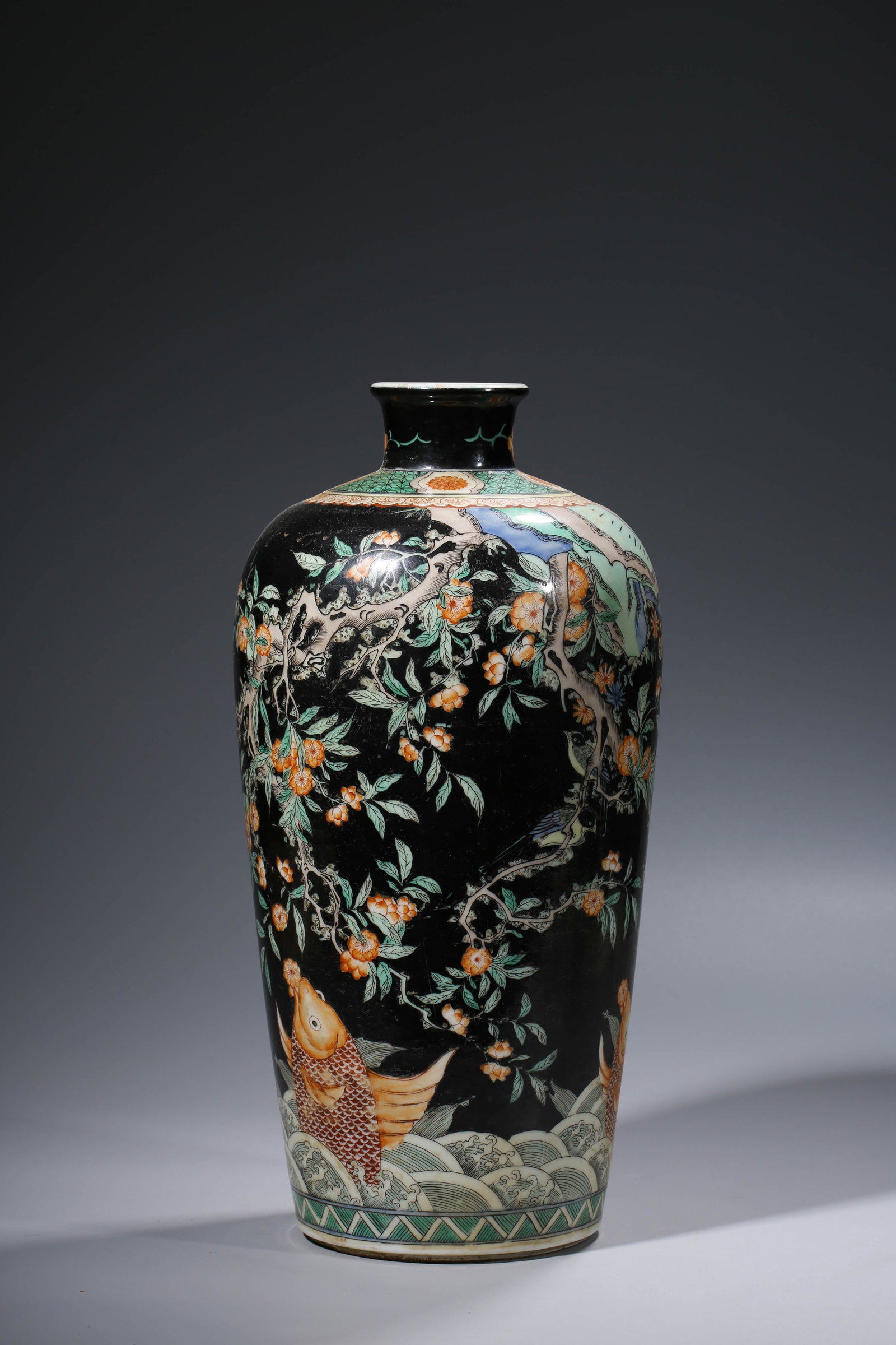 A BLACK-GROUND WUCAI 'FLOWERS AND BIRDS' VASE: A BLACK-GROUND WUCAI 'FLOWERS AND BIRDS' VASE Description: Dimensions: Width: 19.6 cm x Height: 39.3 cm. All measurements are approximate.