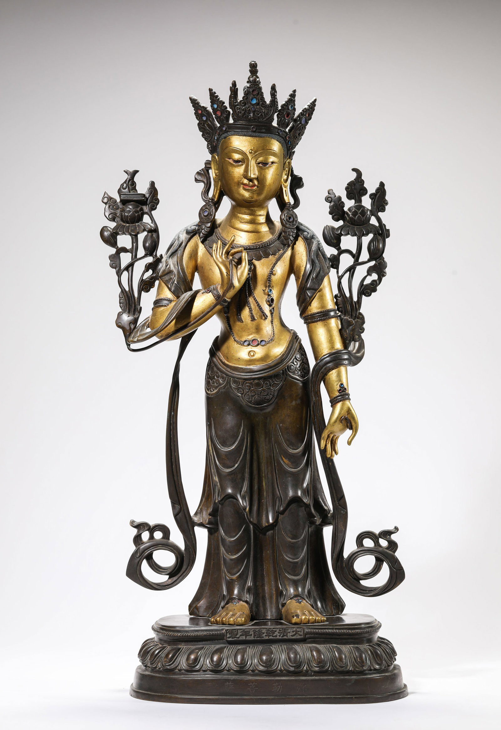 A LACQUERED AND GILT-BRONZE FIGURE OF MAITREYA: A LACQUERED AND GILT-BRONZE FIGURE OF MAITREYA Description: Dimensions: Weight: 10850 g. Length: 26.5 cm x Width: 14.8 cm x Height: 58.5 cm. All measurements are approximate.