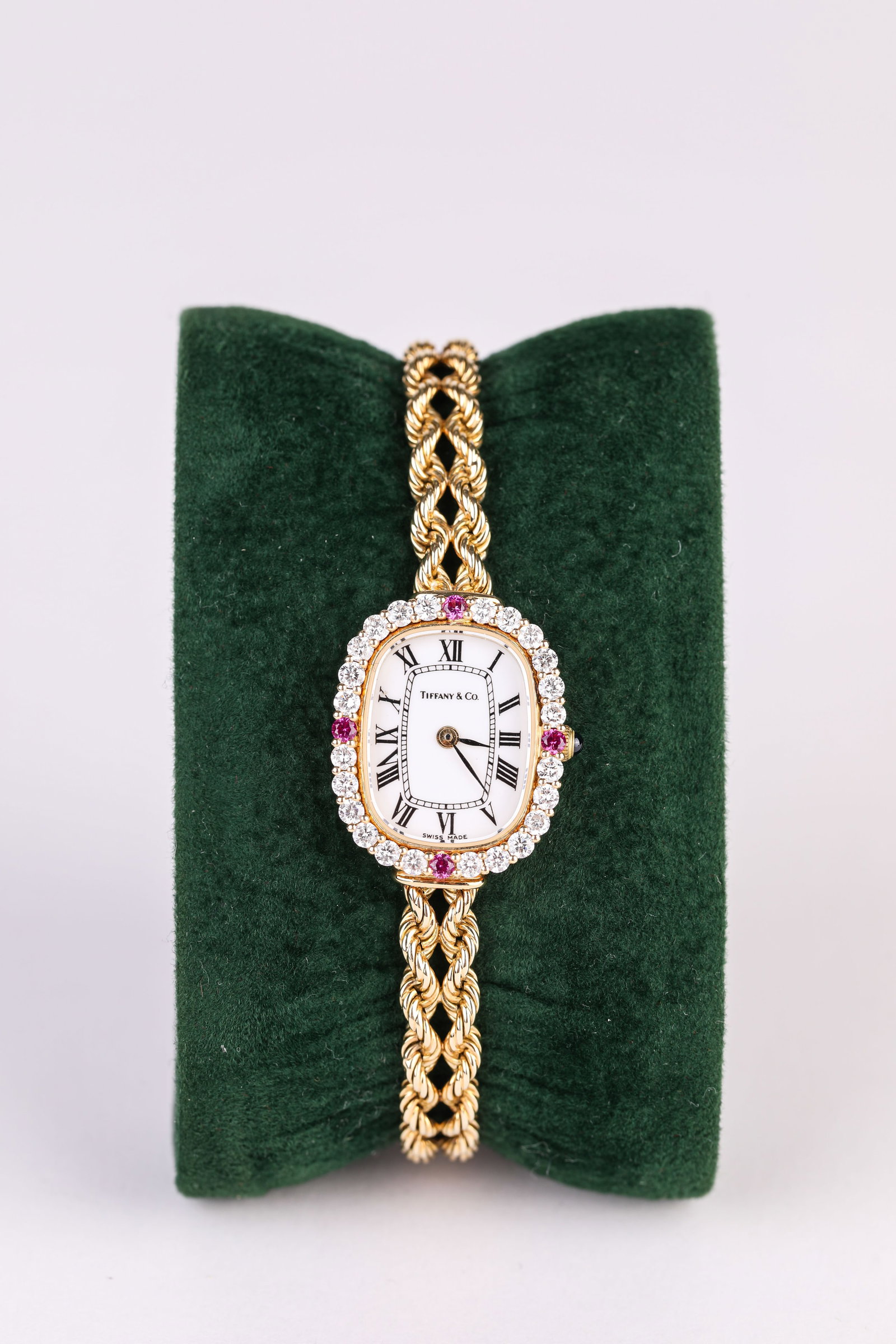 A TIFFANY GOLD AND GEMSTONE POCKET WATCH: A TIFFANY GOLD AND GEMSTONE POCKET WATCH Description: Dimensions: Width: 20 mm x Height: 23 mm. All measurements are approximate.