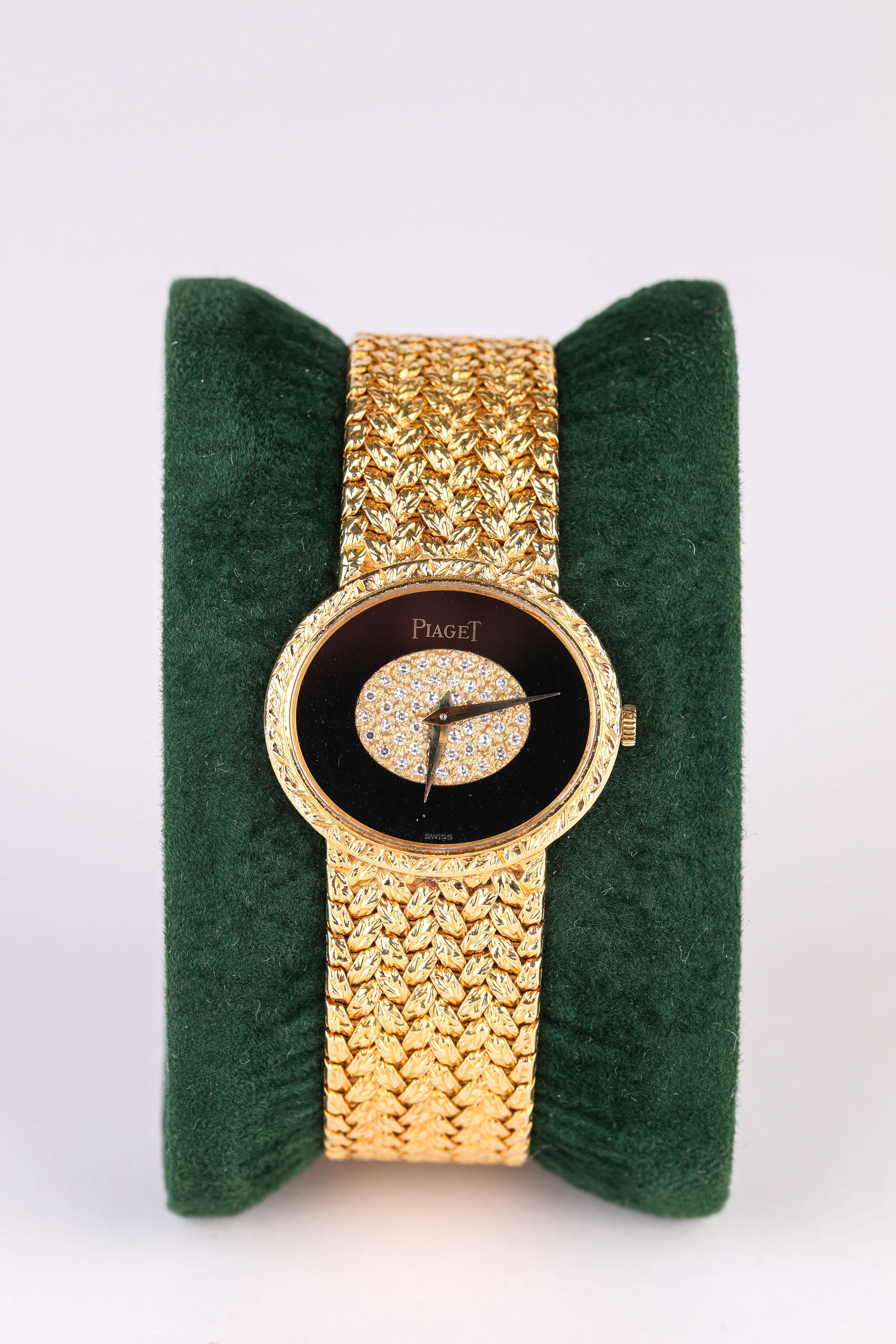 A PIAGET GOLD AND DIAMOND WRISTWATCH: A PIAGET GOLD AND DIAMOND WRISTWATCH Description: Dimensions: Width: 28 mm x Height: 24 mm. All measurements are approximate.