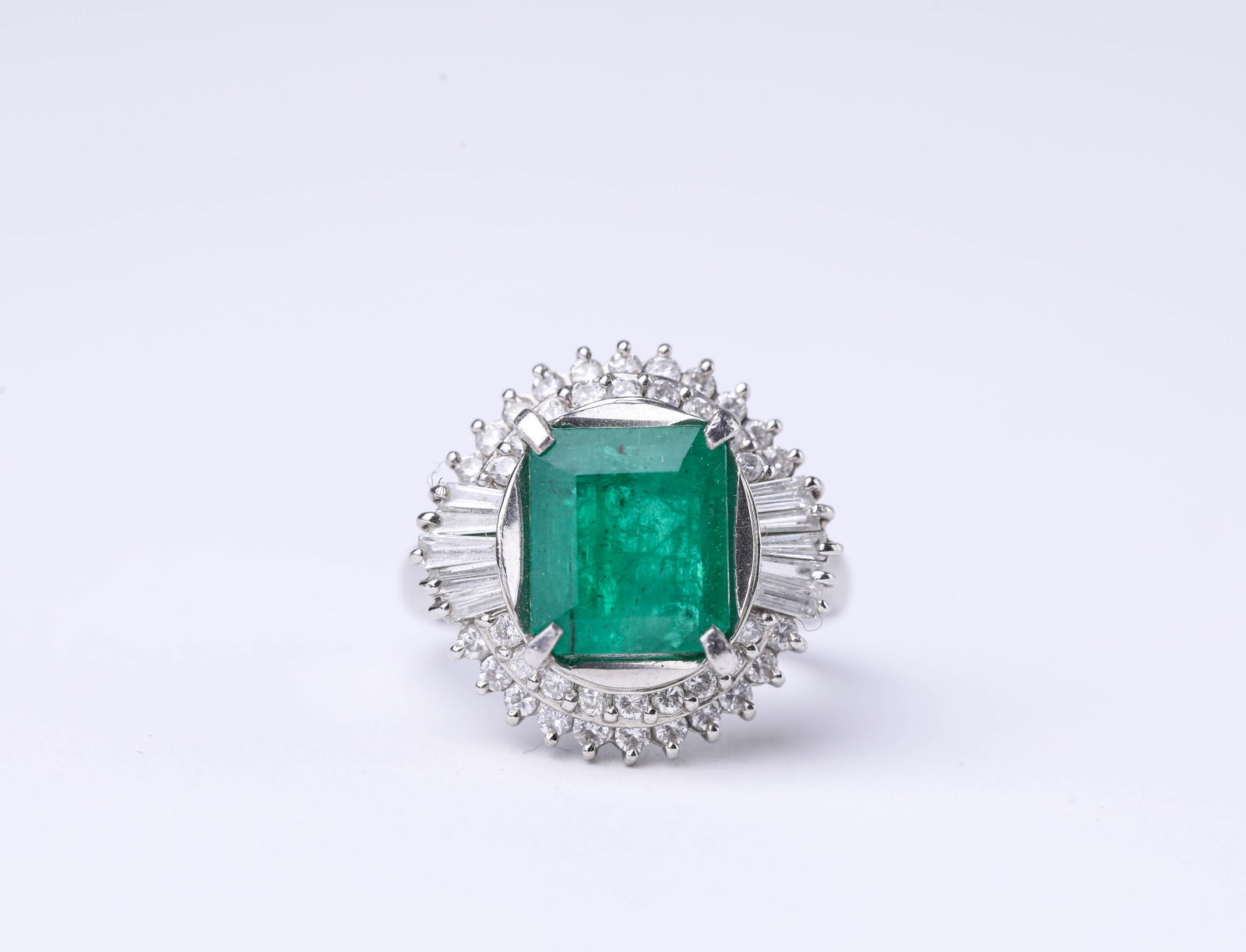 A PLATINUM, EMERALD AND DIAMOND RING (1 of 4)