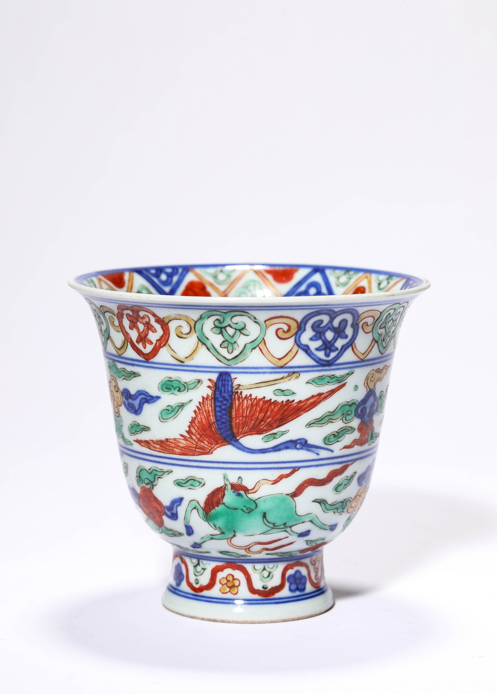 A WUCAI 'FLYING HORSE AND CLOUDS' CUP: A WUCAI 'FLYING HORSE AND CLOUDS' CUP Description: Dimensions: Width: 12.3 cm x Height: 11.4 cm. All measurements are approximate.