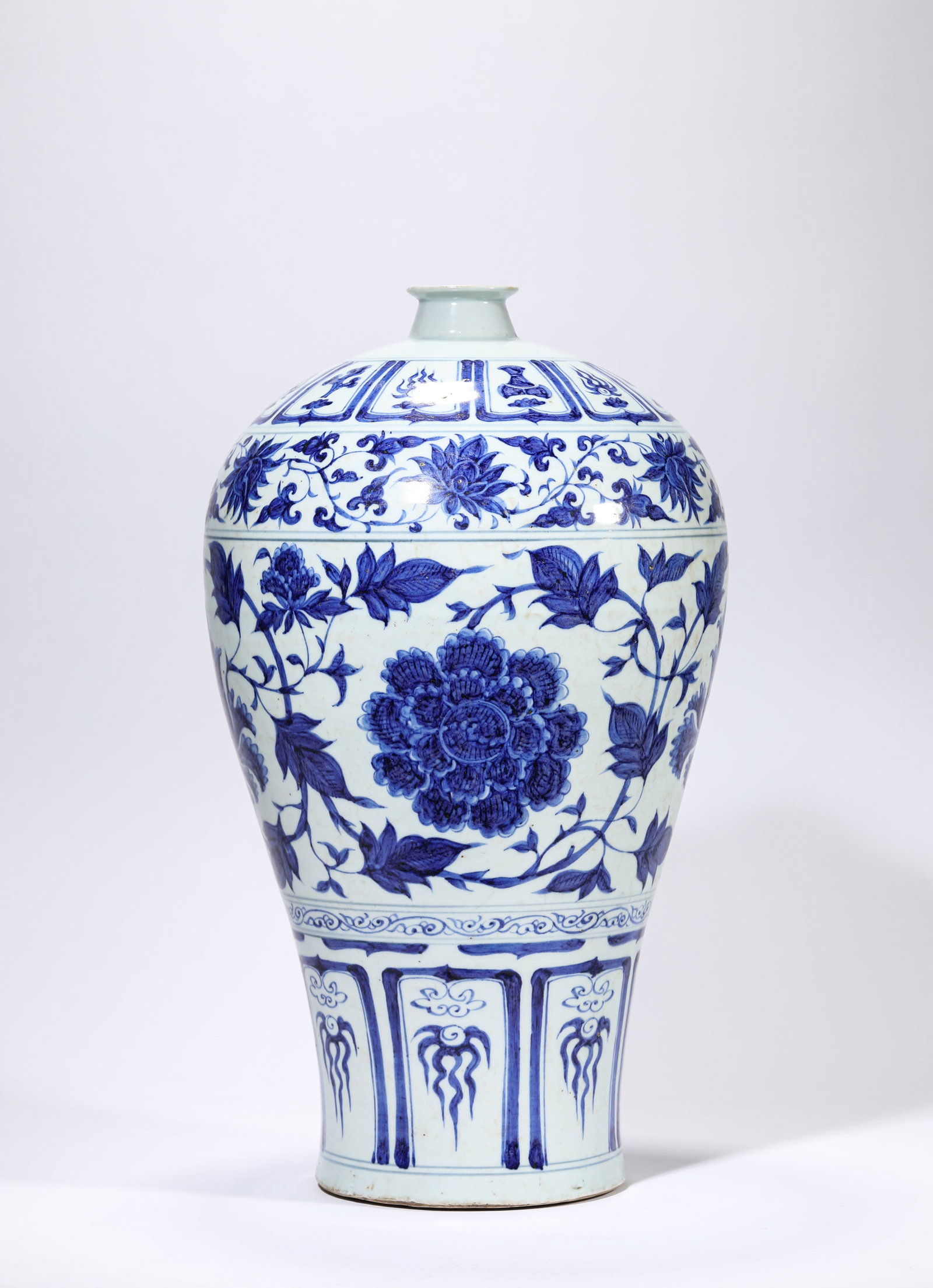 A BLUE AND WHITE 'INTERLOCKING FLORALS' MEIPING: A BLUE AND WHITE 'INTERLOCKING FLORALS' MEIPING Description: Dimensions: Width: 25.3 cm x Height: 43.3 cm. All measurements are approximate.