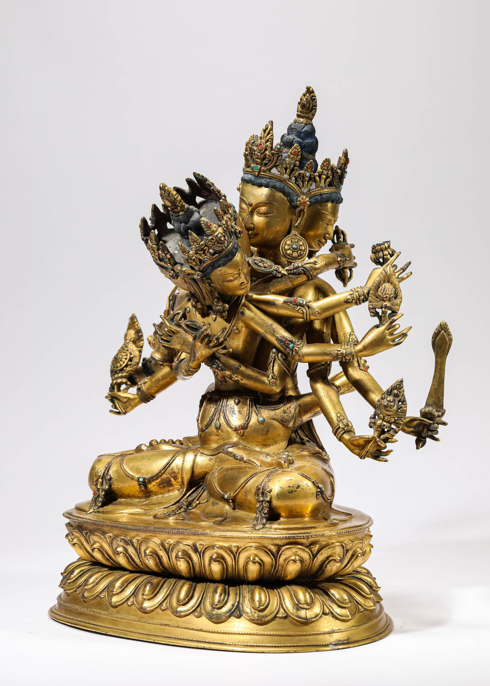 A GILT-BRONZE FIGURE OF GUHYASAMAJA: A GILT-BRONZE FIGURE OF GUHYASAMAJA Description: Dimensions: Weight: 14600 g. Length: 34 cm x Width: 22 cm x Height: 42.5 cm. All measurements are approximate.