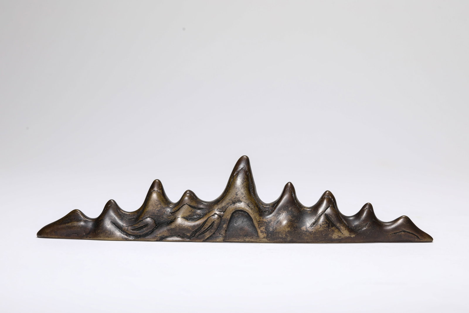 A BRONZE 'MOUNTAIN' ORNAMENT - 2