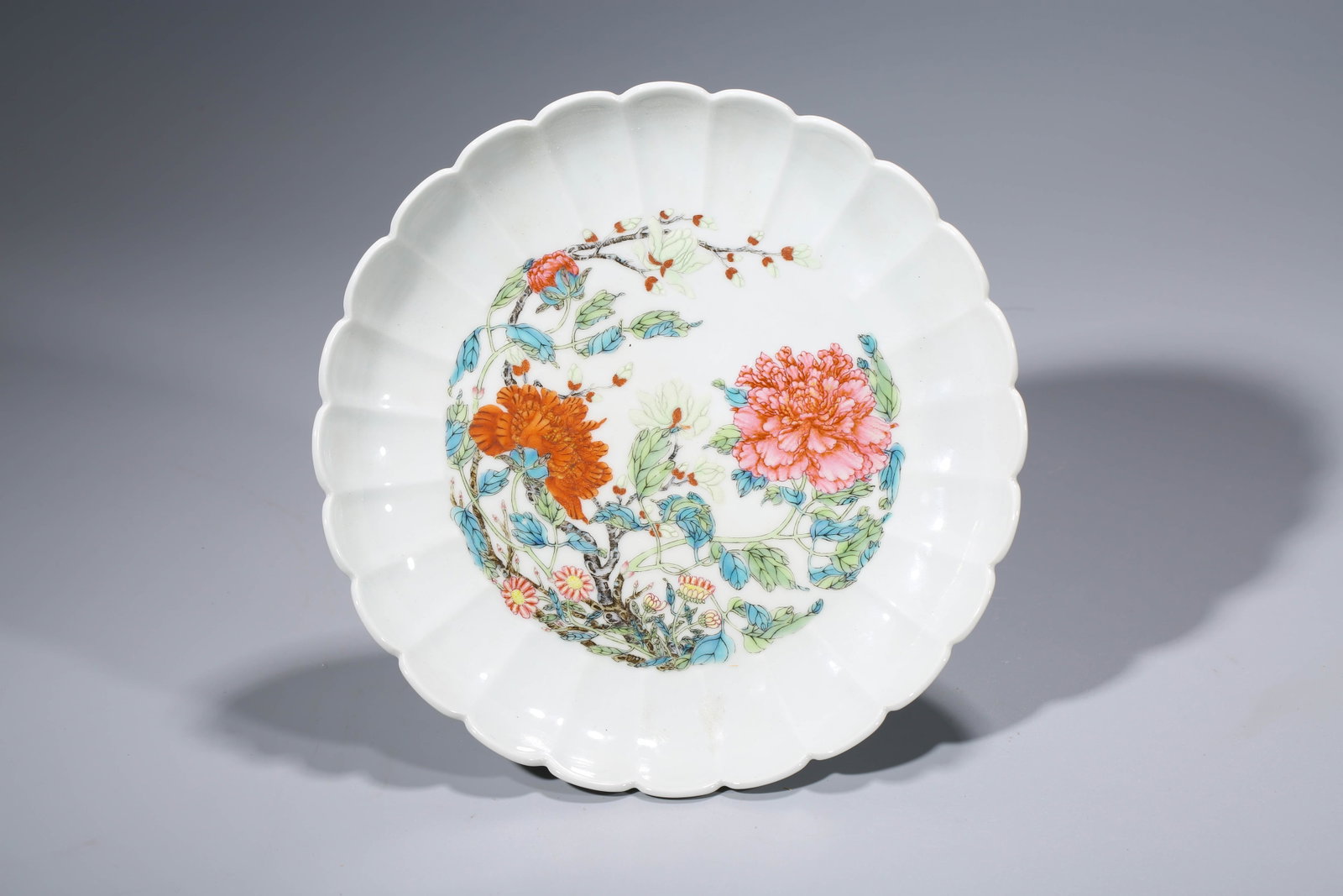 A FAMILLE-ROSE 'CHRYSANTHEMUM-PETAL AND PEONY? DISH: A FAMILLE-ROSE 'CHRYSANTHEMUM-PETAL AND PEONY? DISH Description: Dimensions: Width: 23.2 cm x Height: 4.4 cm. All measurements are approximate.