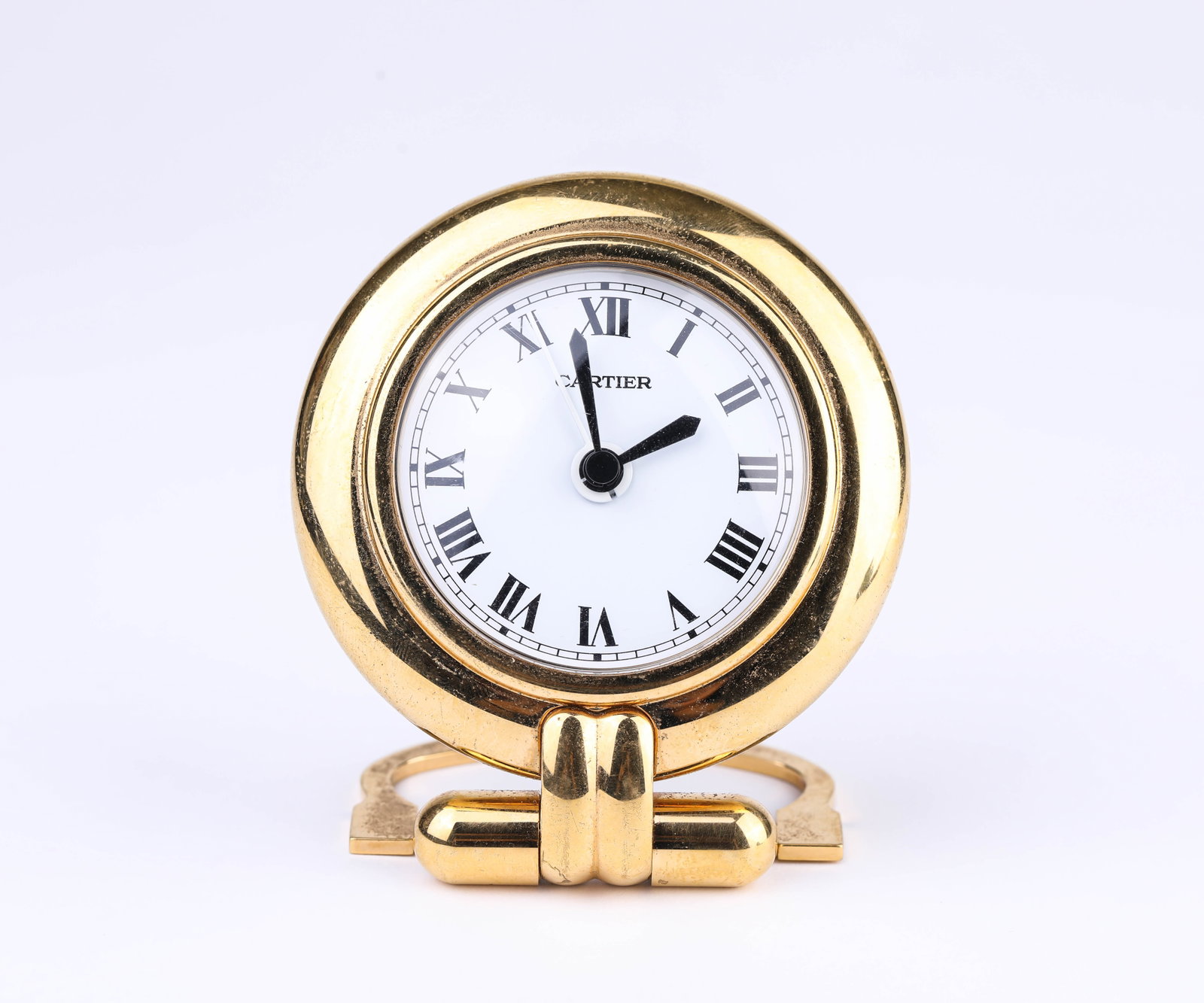 A CARTIER CARRIAGE CLOCK: A CARTIER CARRIAGE CLOCK Description: Dimensions: Weight: 318 g. Length: 78.4 mm x Width: 61.8 mm x Height: 90.2 mm. All measurements are approximate.
