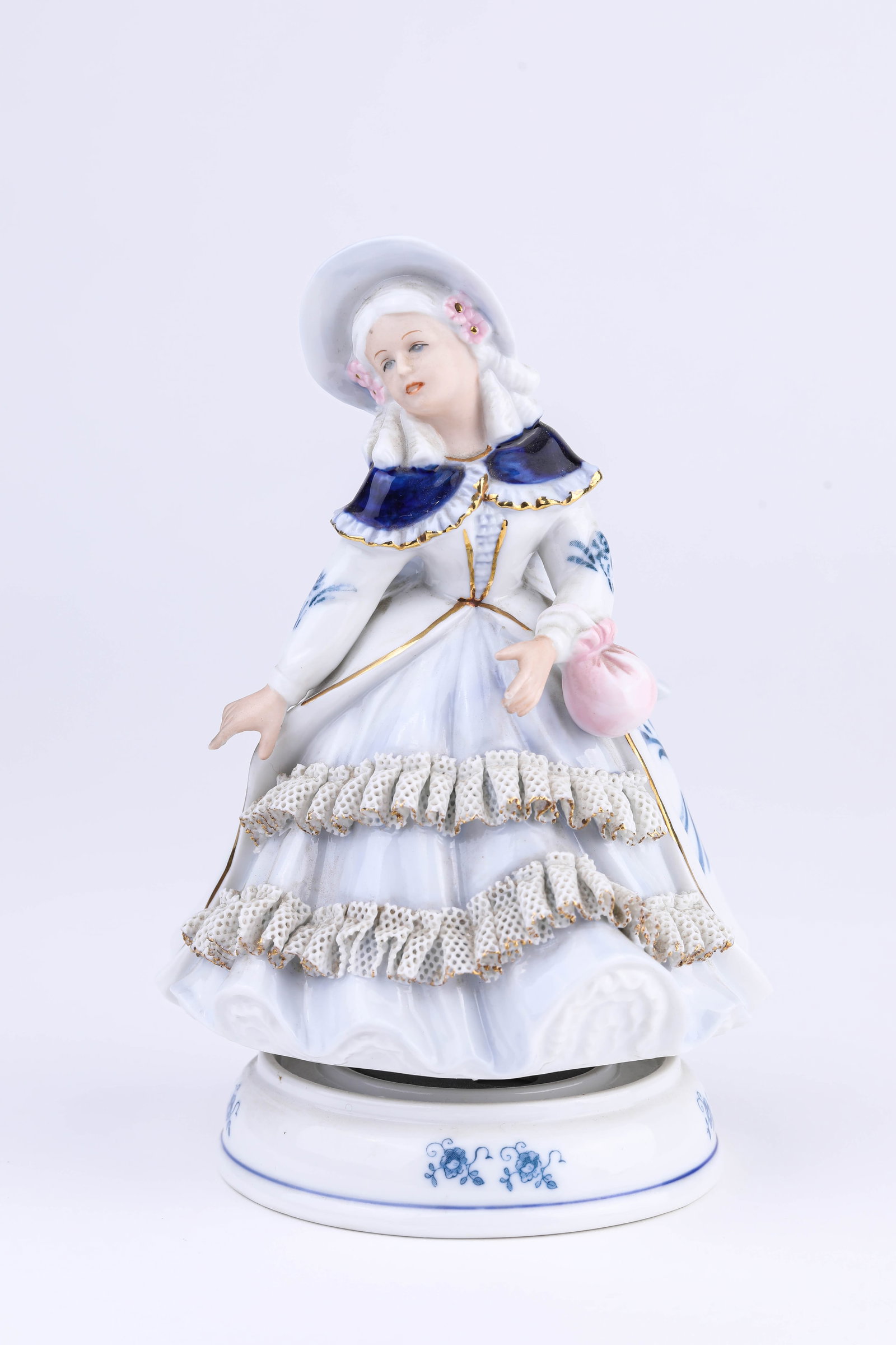 A PORCELAIN FIGURE MUSIC BOX: A PORCELAIN FIGURE MUSIC BOX Description: Dimensions: Width: 11.1 cm x Height: 17 cm. All measurements are approximate.