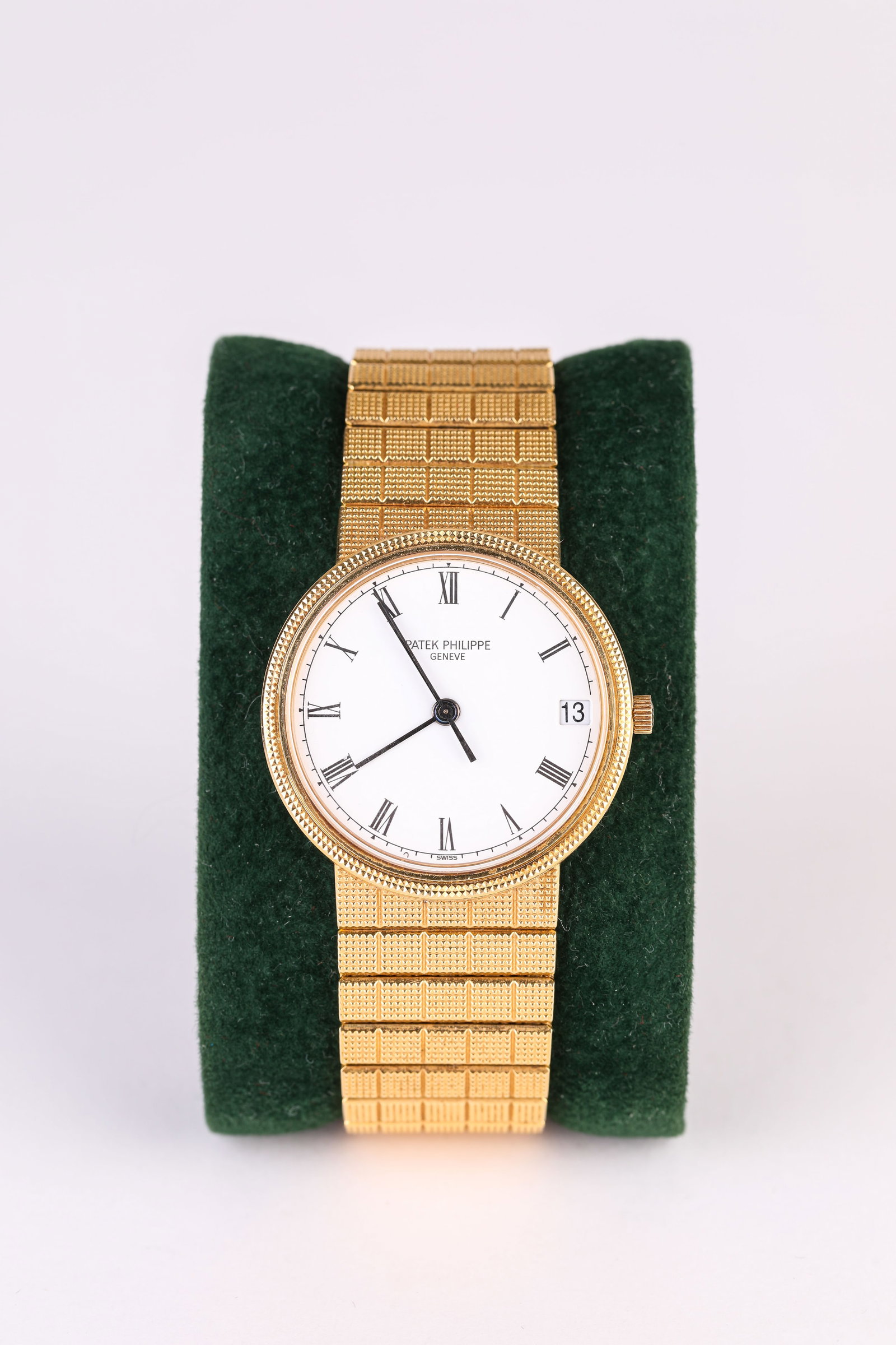 A PATEK PHILIPPE GOLD WRISTWATCH: A PATEK PHILIPPE GOLD WRISTWATCH Description: Dimensions: Width: 35 mm. All measurements are approximate.