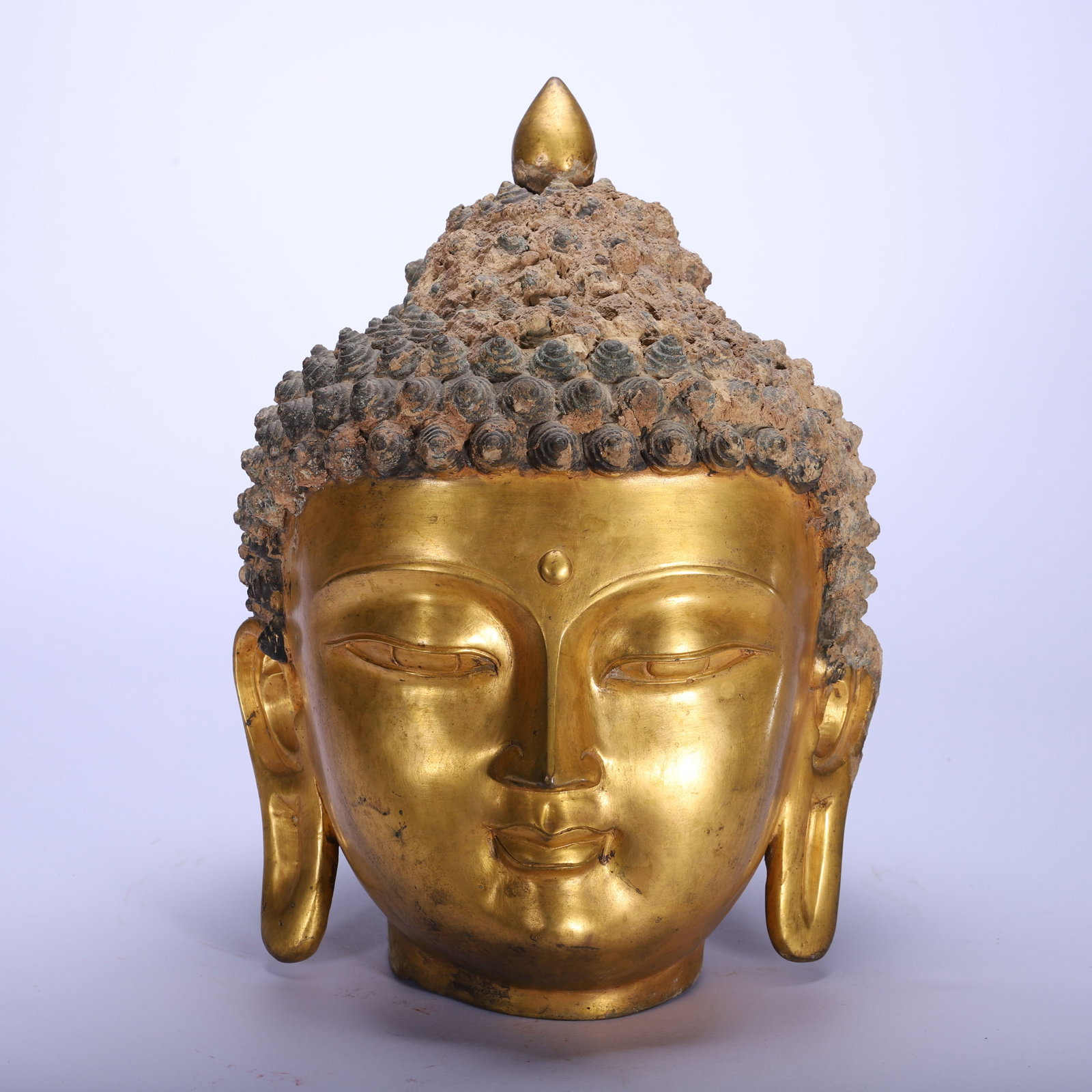 A Chinese Gilt-Bronze Buddha Head: A Chinese Gilt-Bronze Buddha Head (23 x 23 x 33cm,Weight 5550 grams)