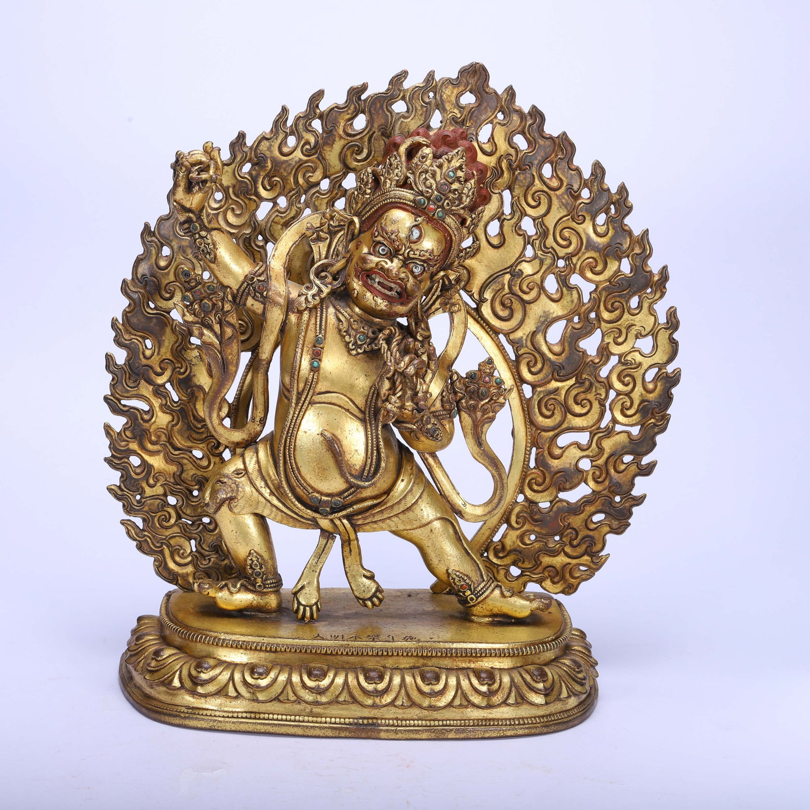 A BRONZE-GILT FIGURE OF BEGTSE CHEN (1 of 9)