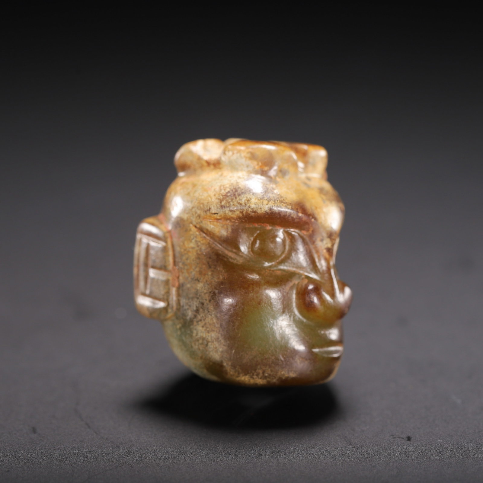 A CARVED JADE MYTHICAL BEAST HEAD - 6