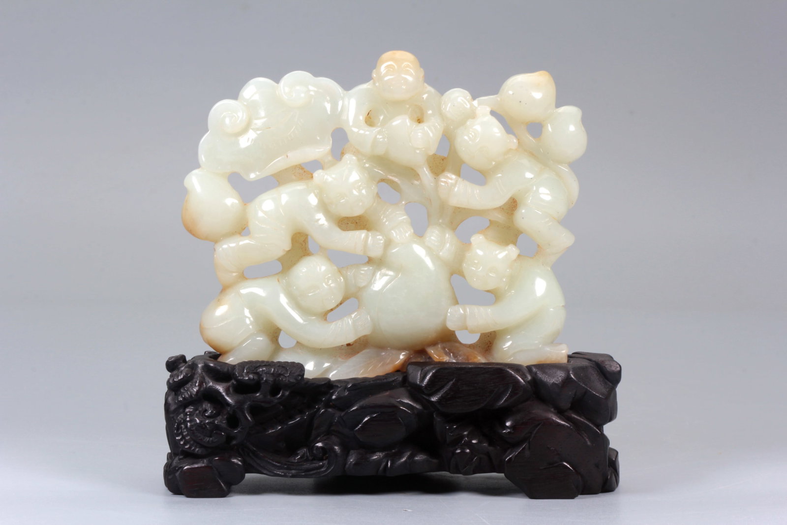A HETIAN JADE FIVE SONS HOLDING LONGEVITY WINE ORNAMENT: A HETIAN JADE FIVE SONS HOLDING LONGEVITY WINE ORNAMENT Height:10.4cm,Width:12.5cm