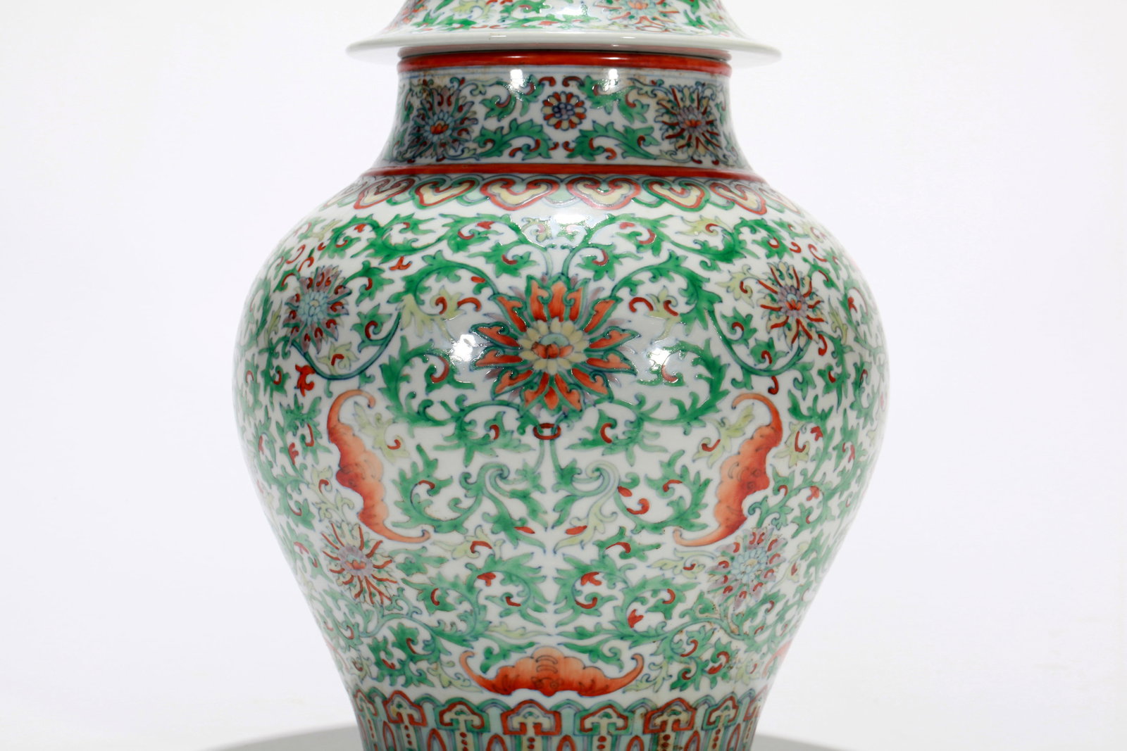 A DOUCAI FLORAL COVERED JAR - 12