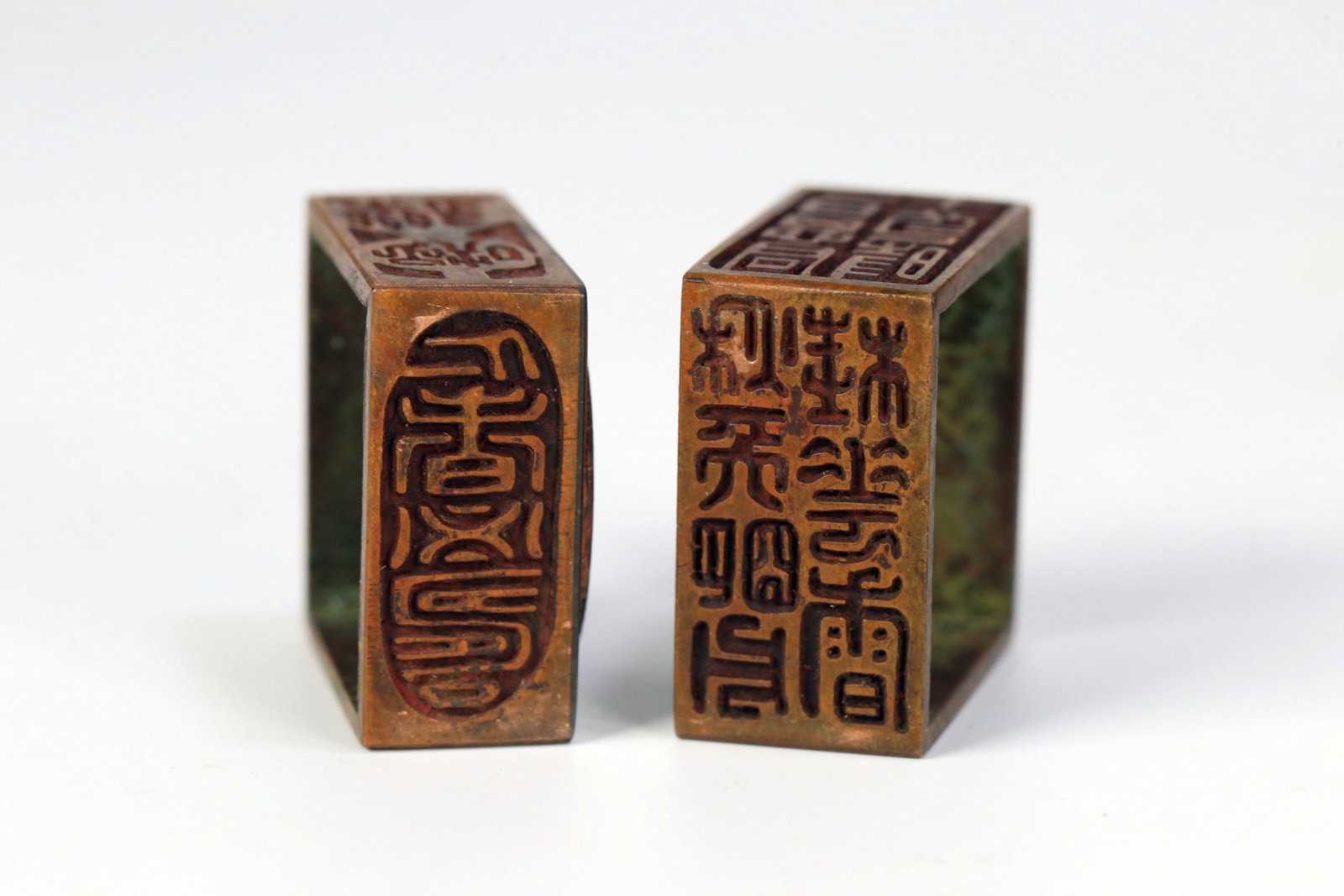 A BRONZE NESTED SEAL SET - 5
