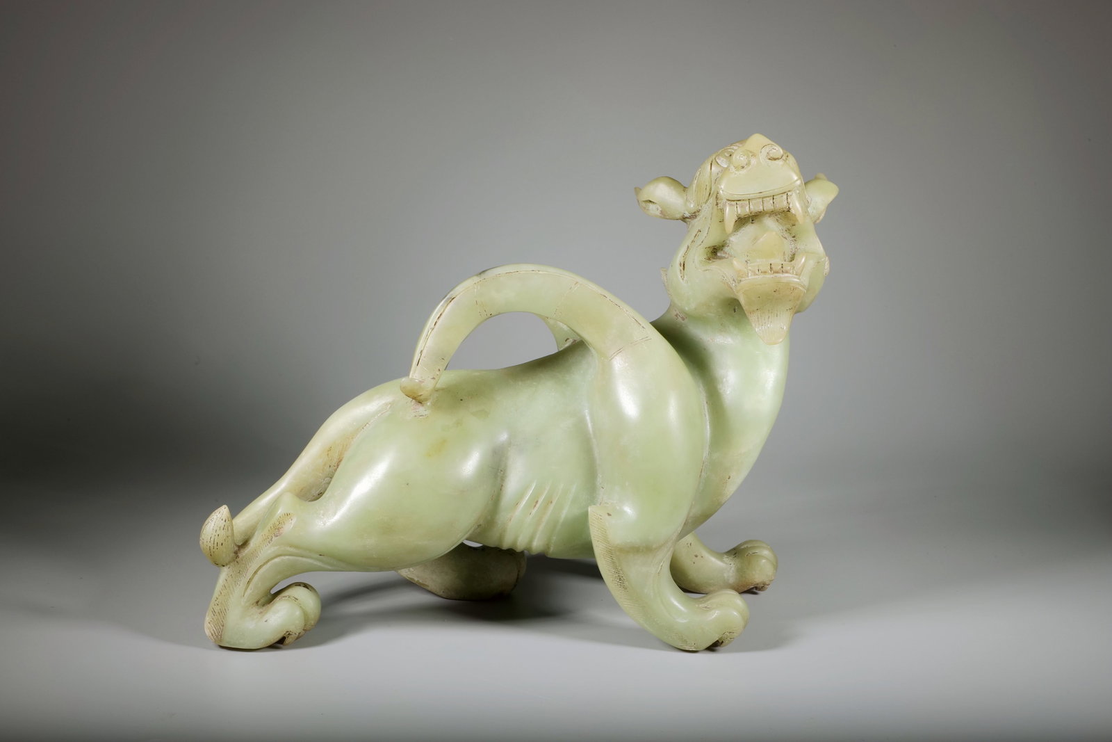 A JADE TIGER ORNAMENT: A JADE TIGER ORNAMENT Length:31cm,Width:11cm,Height:24cm
