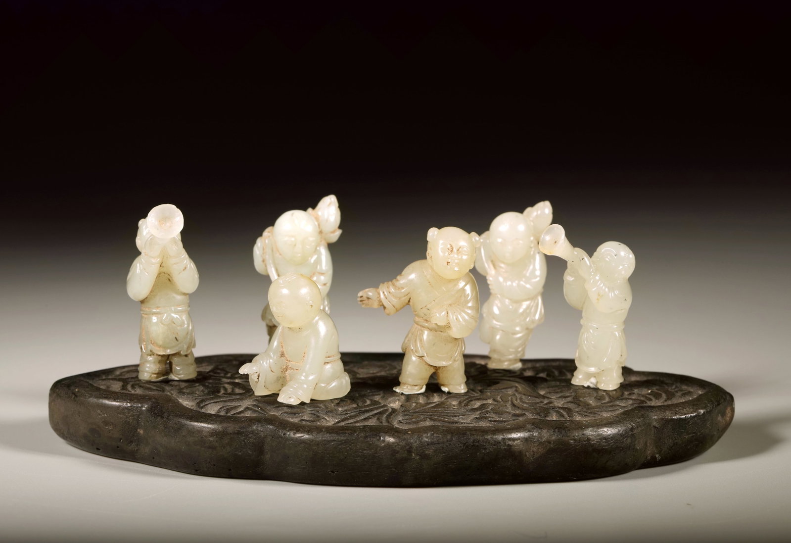 A HETIAN JADE CARVED VARIOUS CHILD FIGURES GROUP OF SIX: A HETIAN JADE CARVED VARIOUS CHILD FIGURES GROUP OF SIX Height:3.2cm,Width:2.8cm