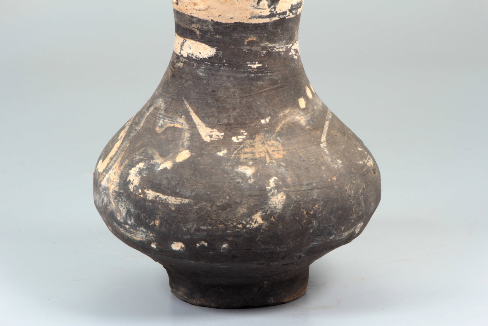 A BLACK POTTERY COVERED VASE - 3