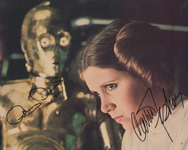 Star Wars signed lobby card: Star Wars signed lobby card autographed by Anthony Daniels and Carrie Fisher. 8x10 inchesâ€”-This autograph is certified by a 20 year plus member of IADA (International Autograph Dealers