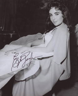 Elizabeth Taylor signed photo: Elizabeth Taylor autographed photo.â€”-This autograph is certified by a 20 year plus member of IADA (International Autograph Dealers Association) , UACC (Universal Autograph Collectors Club),