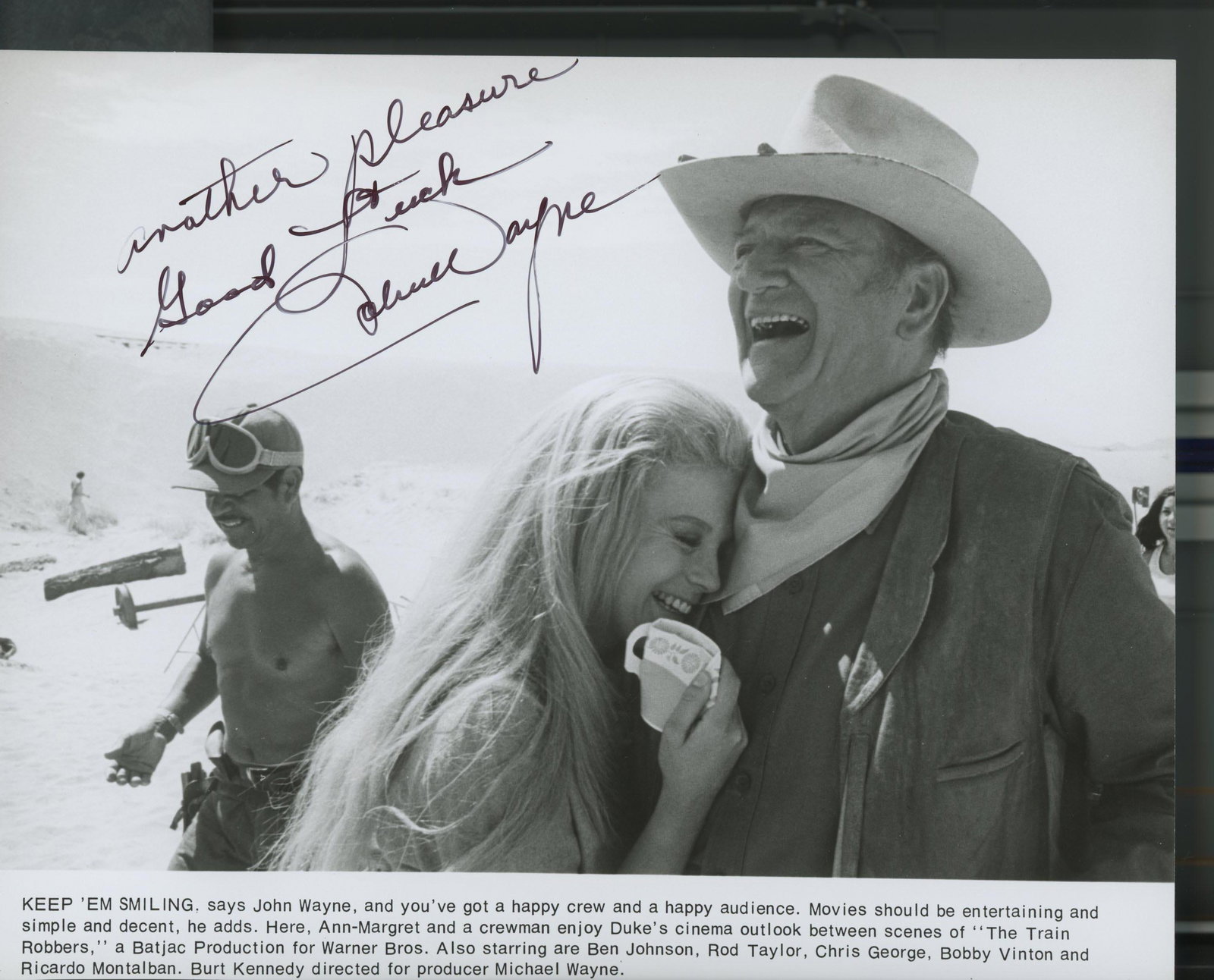 John Wayne signed movie photo: The Train Robbers signed movie photo autographed by John Wayne. 8x10 inches.