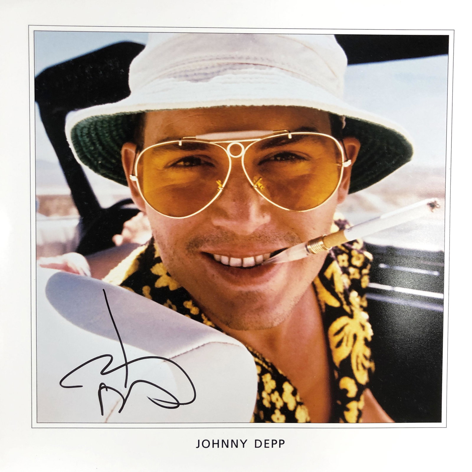 Fear and Loathing in Las Vegas Johnny Depp signed movie: Fear and Loathing in Las Vegas signed movie photo autographed by Johnny Depp. 12x12 inches
