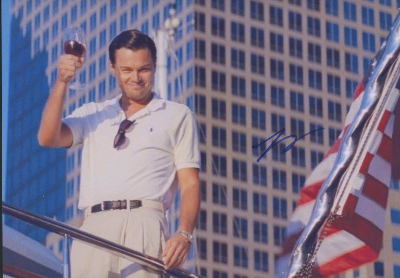 Leonardo DiCaprio signed The Wolf of Wall Street photo: The Wolf of Wall Street signed movie photo autographed by Leonardo DiCaprio. 8x11.5 inches