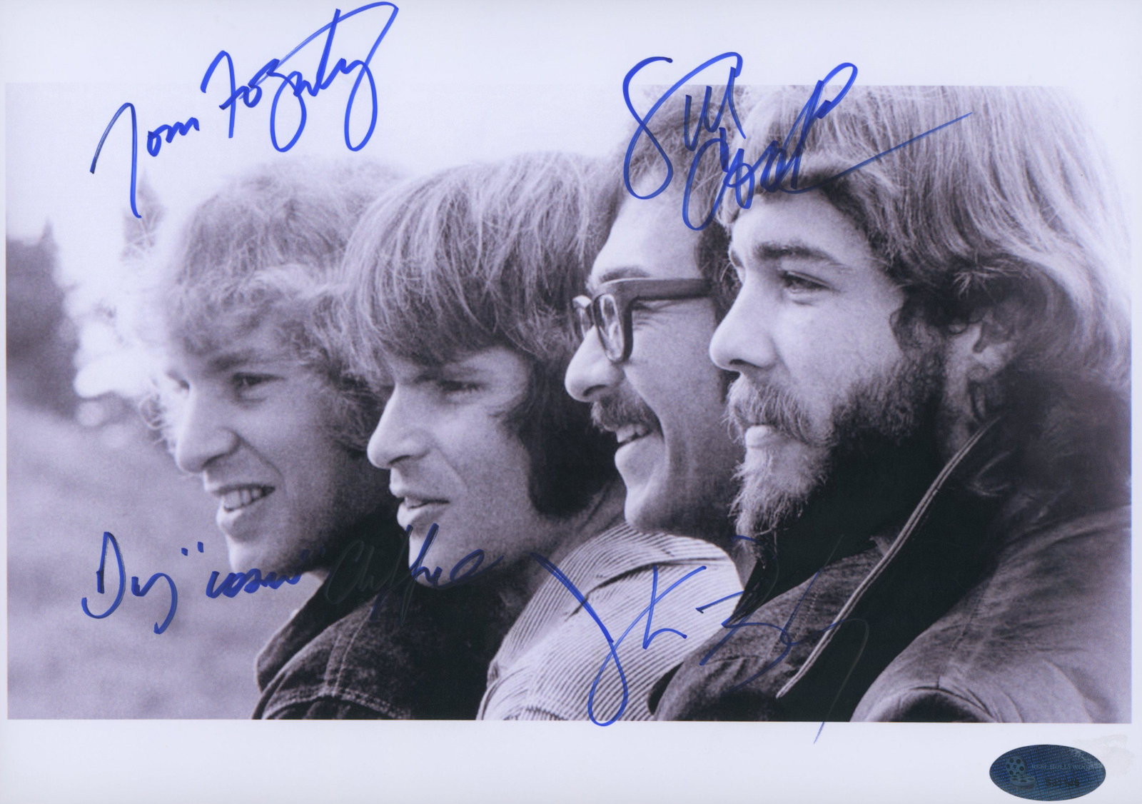 Creedence Clearwater Revival signed photo: Creedence Clearwater Revival signed photo autographed by John Fogerty, Tom Fogerty, Stu Cook, Doug Clifford. 8x11.5 inches