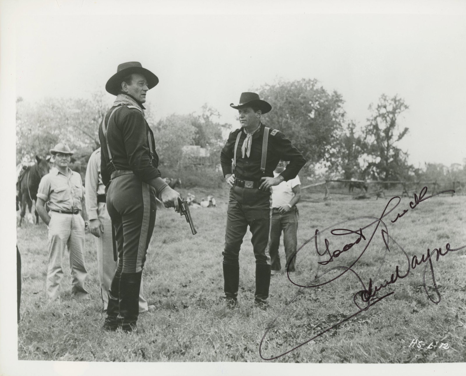 John Wayne signed movie photo: The Horse Soldiers signed movie photo autographed by John Wayne. 8x10 inches