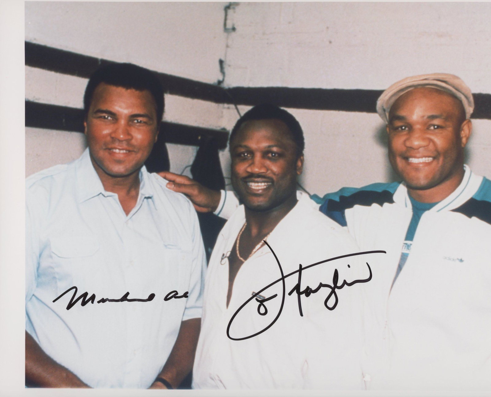 Muhammad Ali and Joe Frazier signed photo: Muhammad Ali, Joe Frazier and George Foreman signed photo autographed by Muhammad Ali and Joe Frazier.