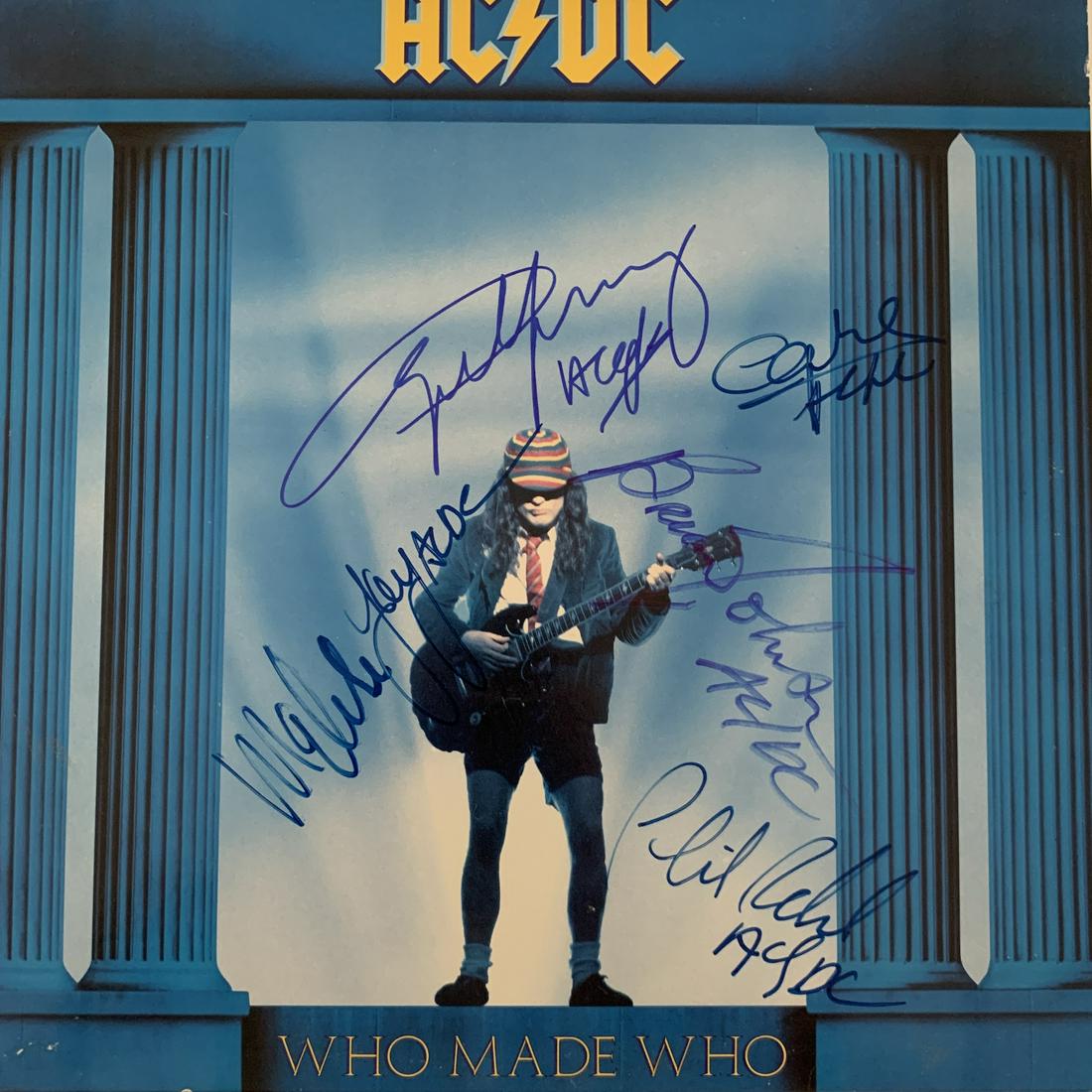 AC/DC signed record: AC/DC Who Made Who record autographed by Brian Johnson, Angus Young, Malcolm Young, Cliff Williams, and Phil Rudd