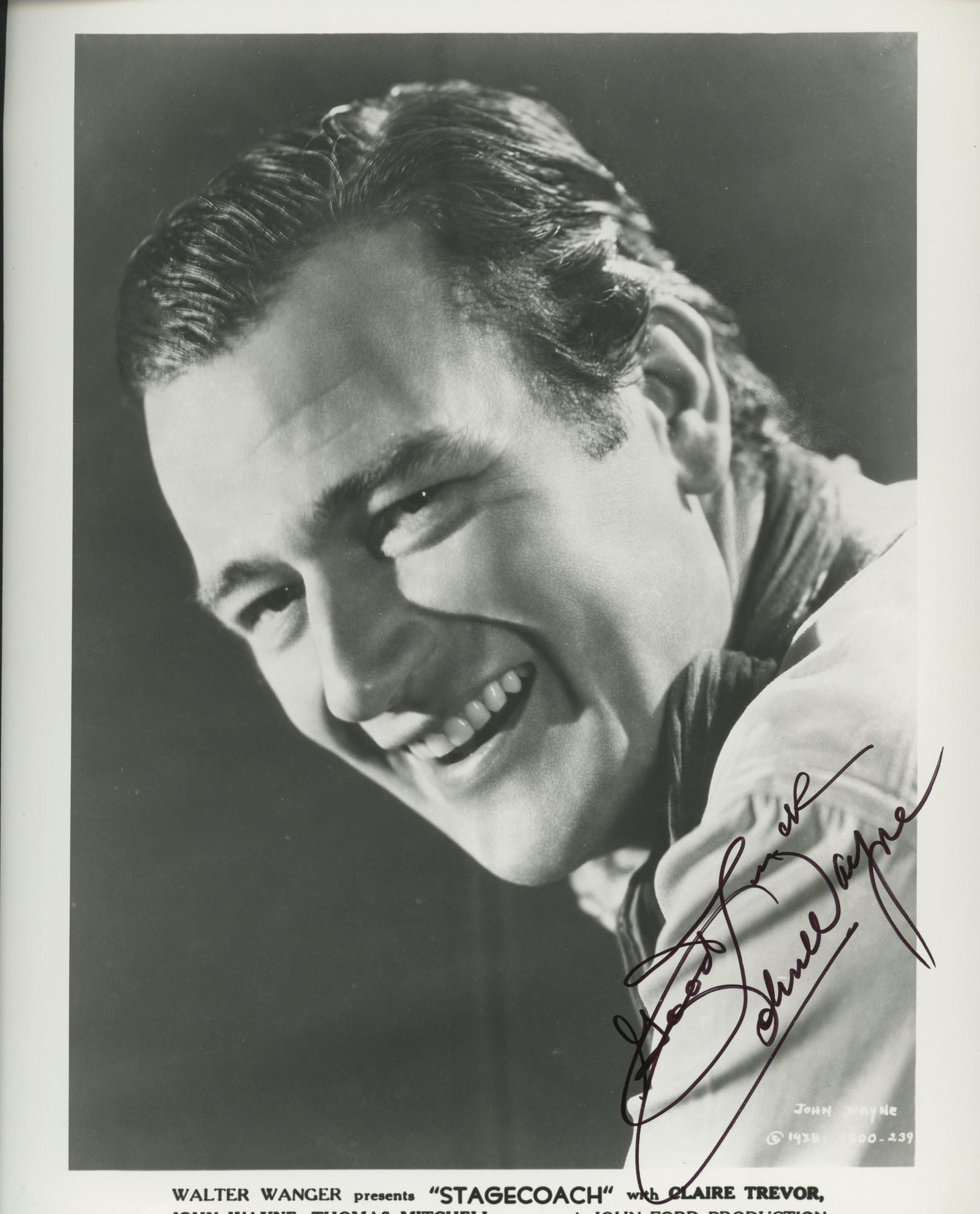 John Wayne signed movie photo: Stagecoach signed movie photo autographed by John Wayne. 8x10 inches